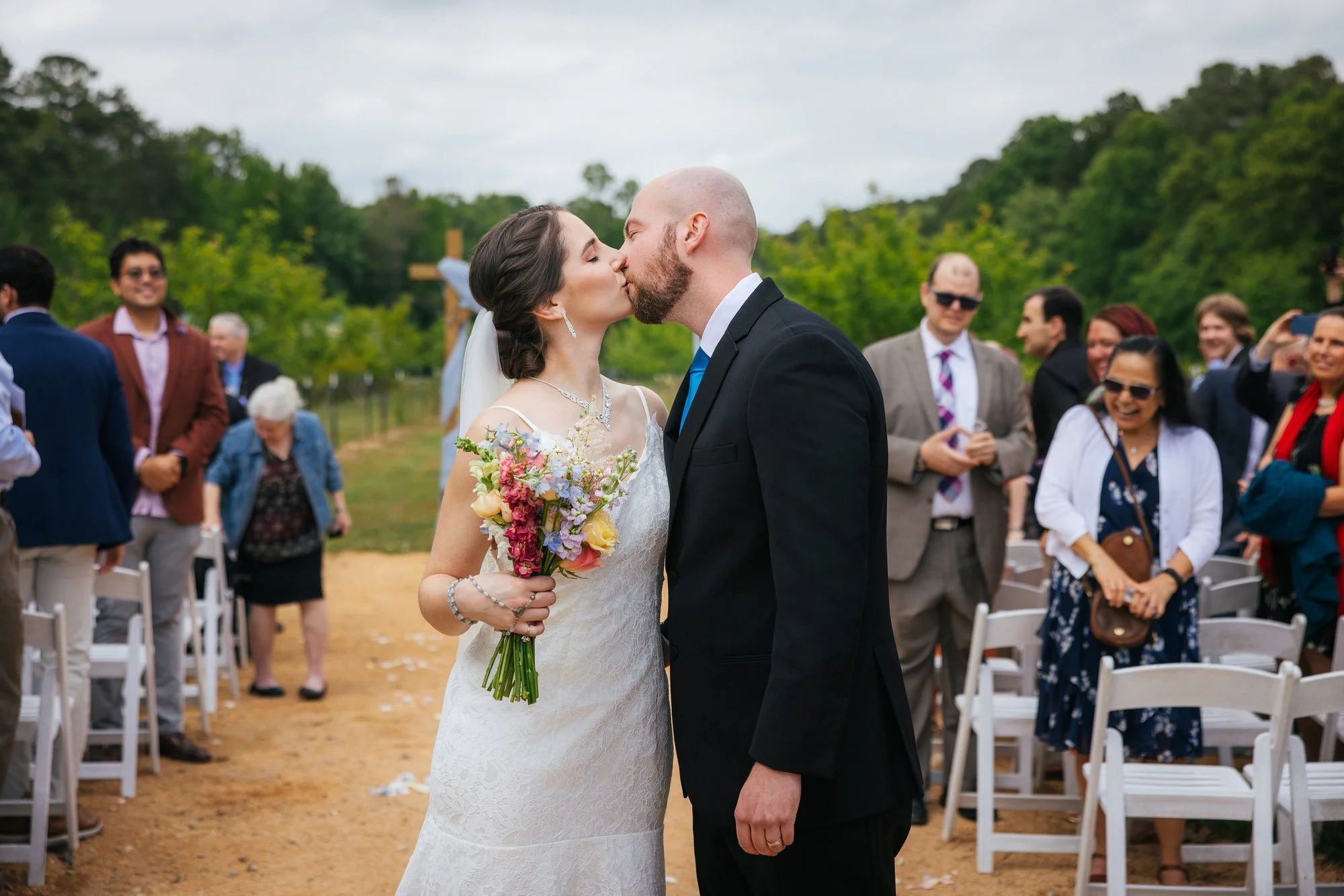 First kiss at The Honeysuckle Tea House — Chapel Hill wedding photographer