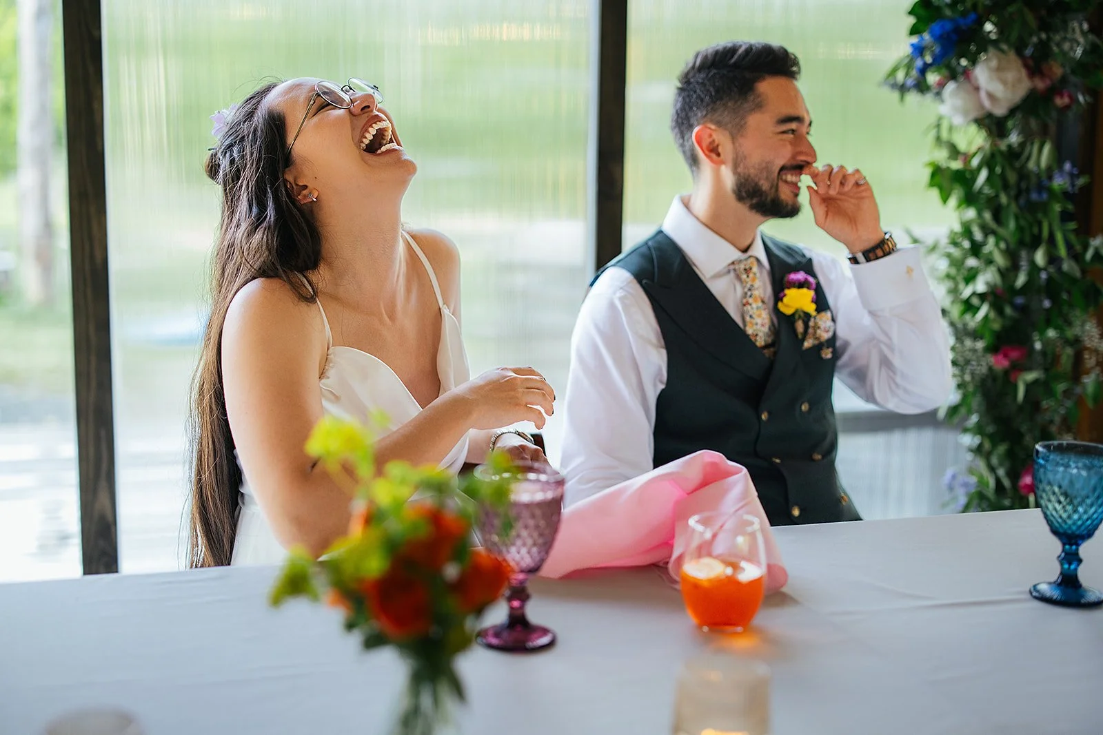 Chapel Hill wedding photographer — couple laughing at reception