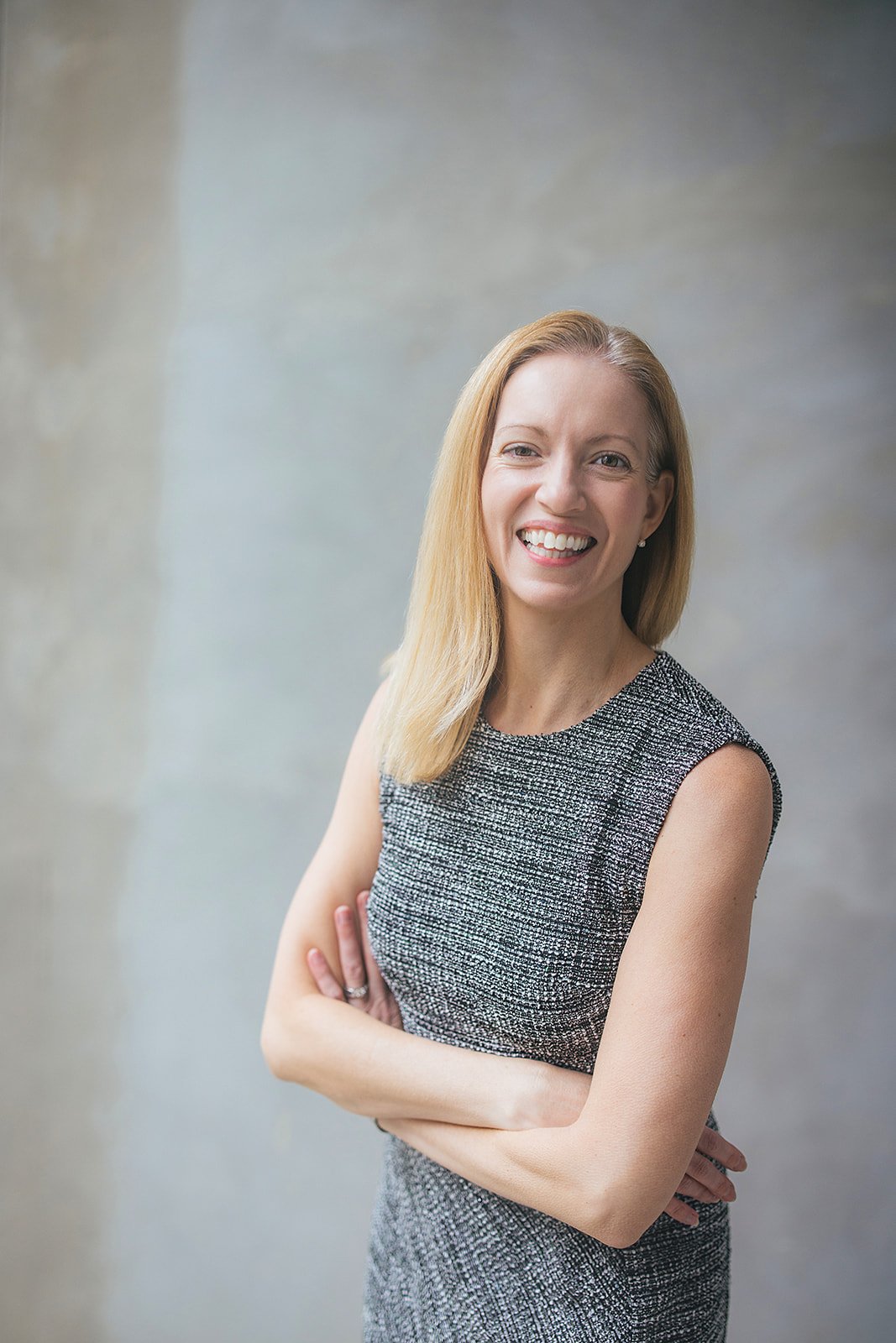 Headshot of Woman Wearing Grey Dress Raleigh NC