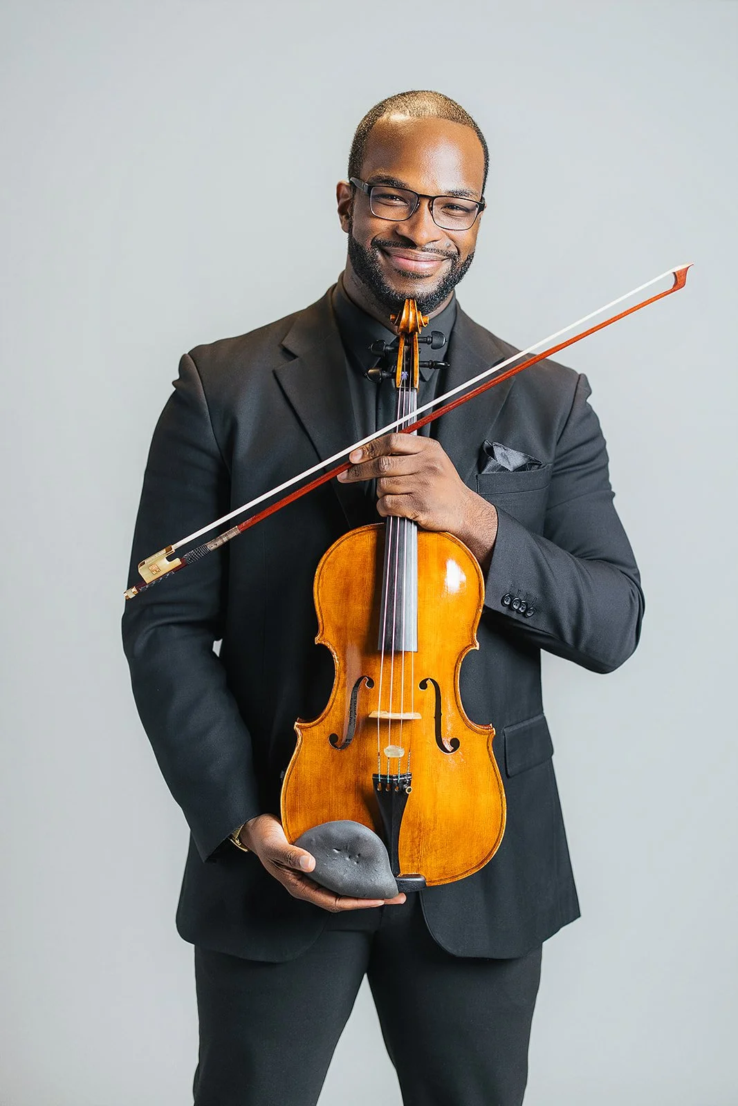 Member of Chamber Orchestra of Triangle Posing with VIolin