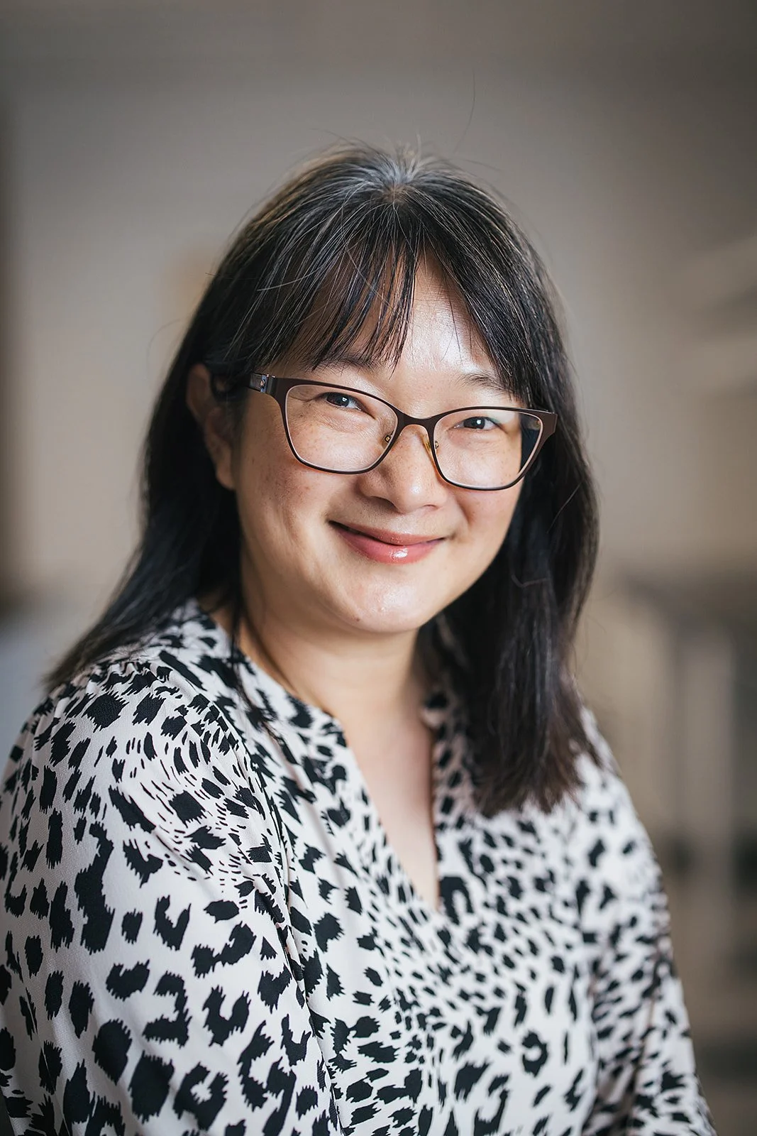 WomanHeadshotWearingBlackAndWhite