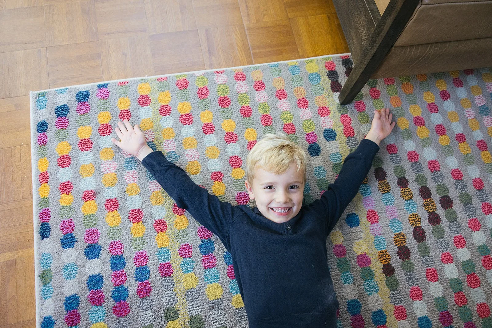 YoungBoyLayingOnCarpetFamilyPhotoSession