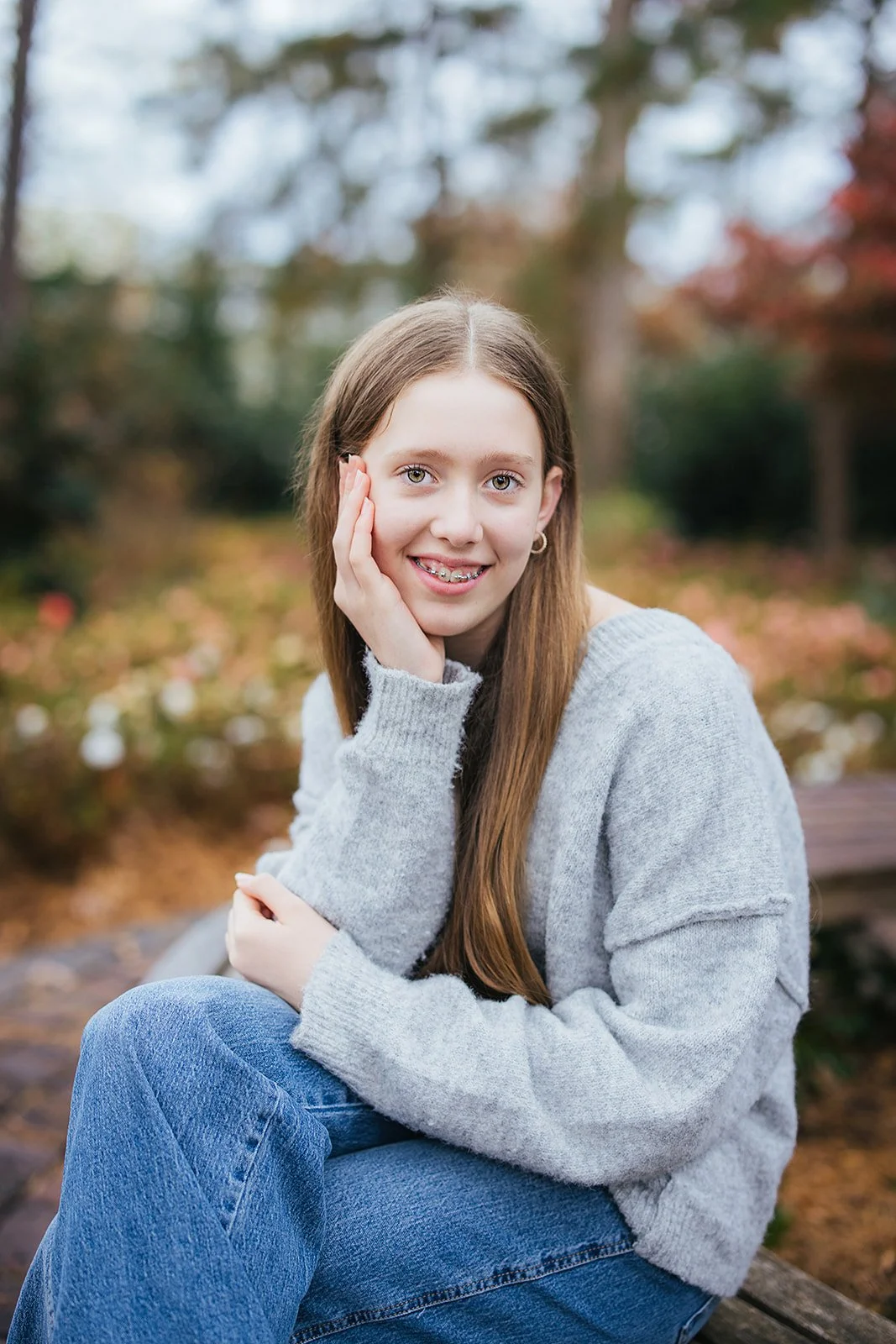 Young Girl Smiling Sitting at WRAL Azalea Garden Raleigh NC
