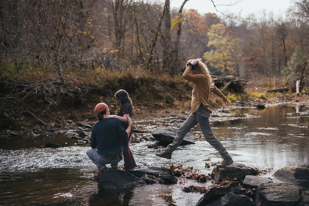 People Standing on Rocks in River in Durham NC