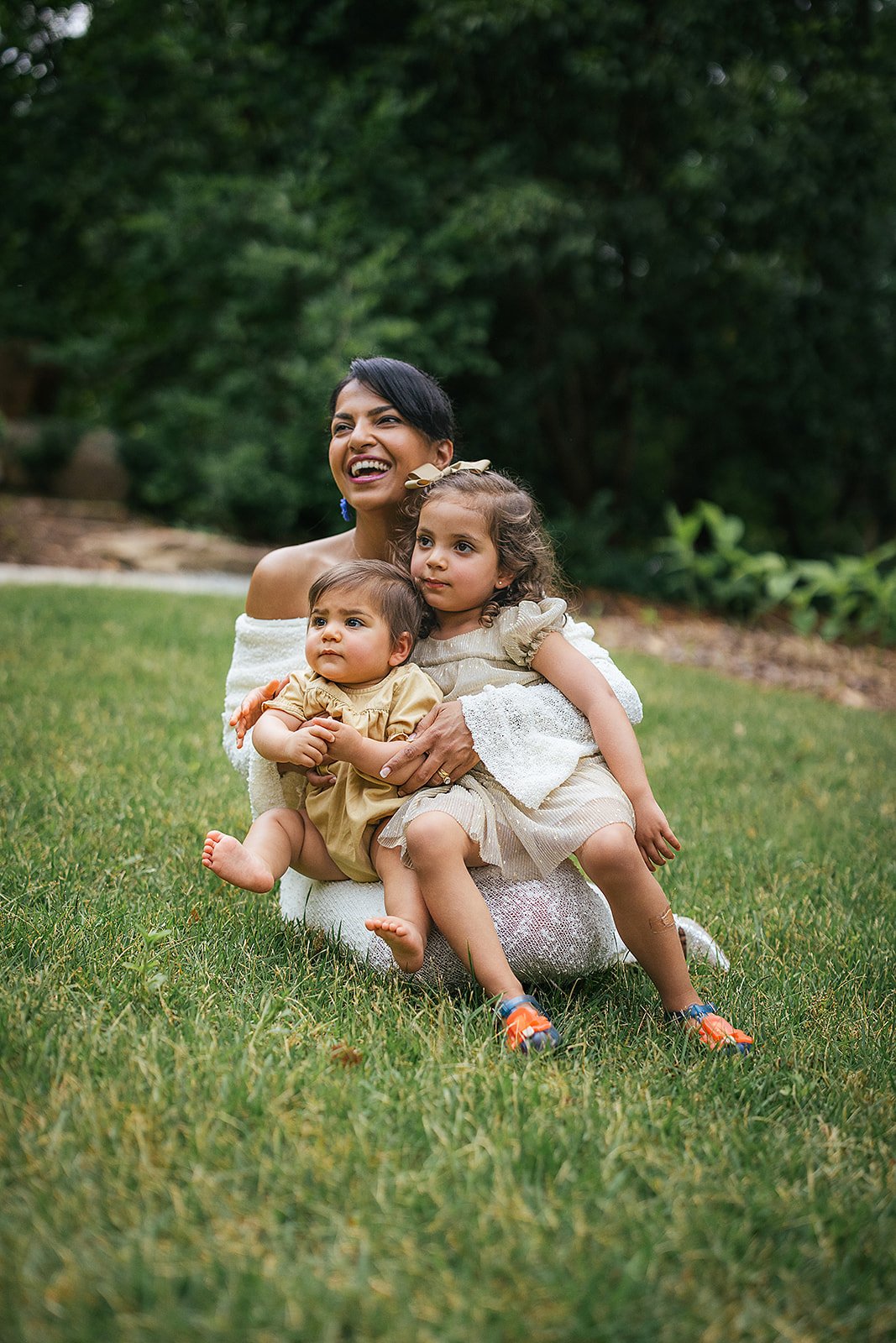 Mom Sitting and Smiling With Two Young Daughters Duke Gardens Durham
