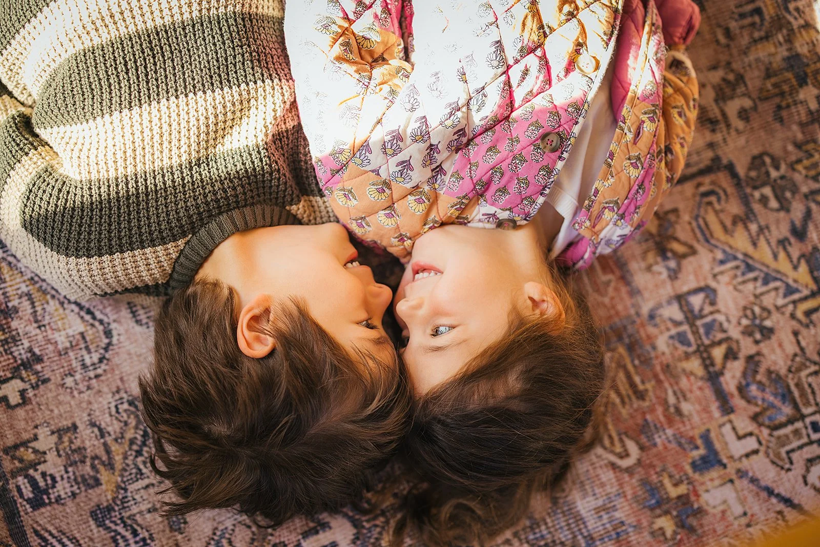 Siblings Looking At Each Others Faces In-Home Family Photo Session Durham NC