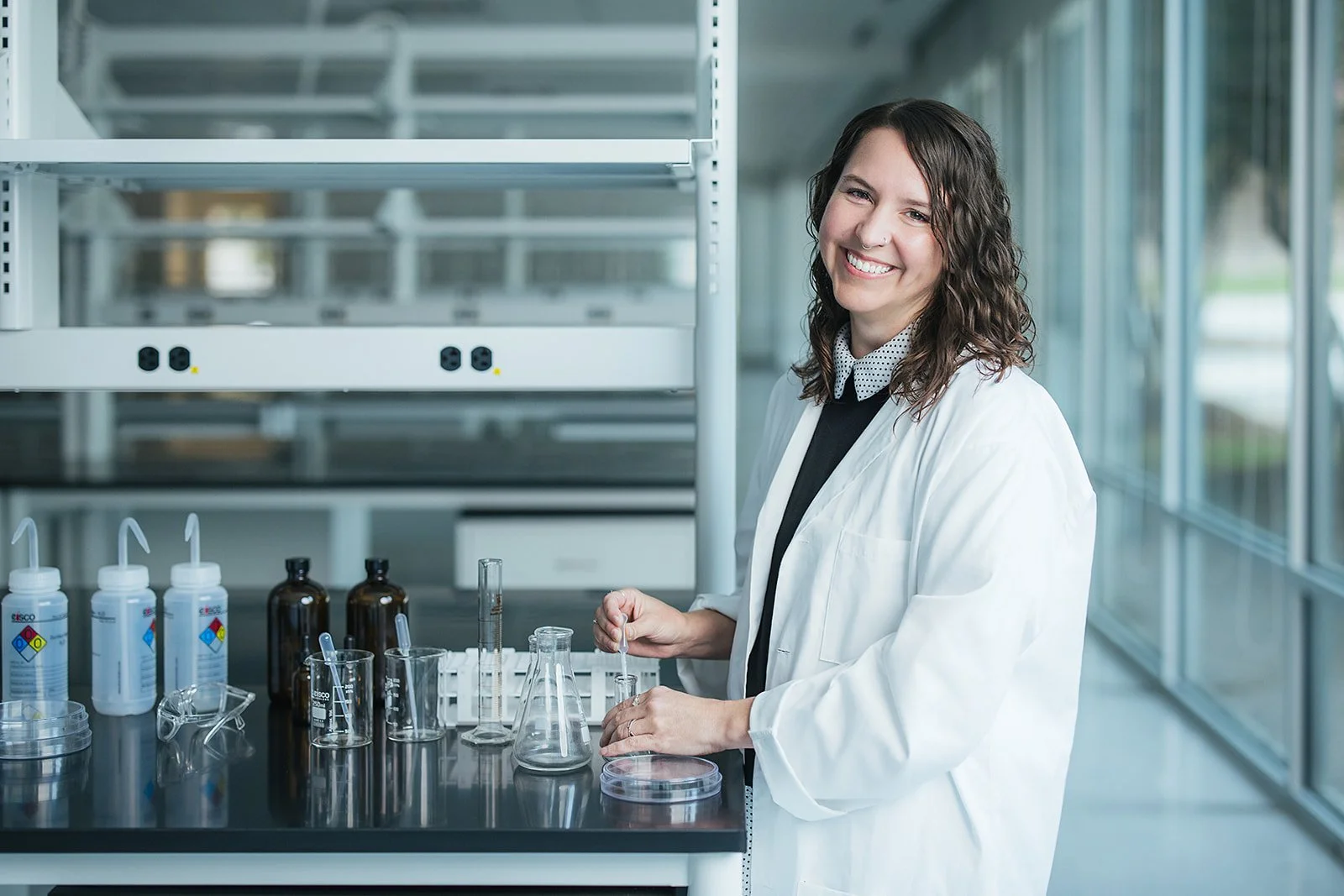 WomanSmilingInWhiteLabCoat