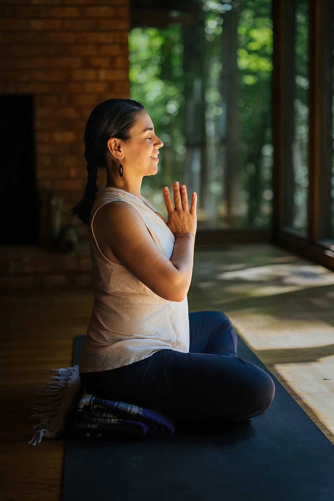 Yoga teacher at rest — closing image of a Durham brand session at The Trees