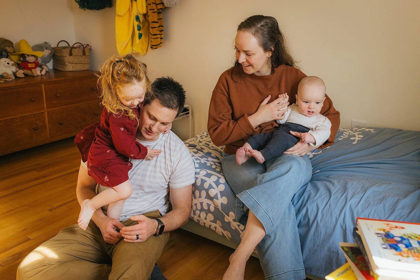 Family plays together in children's room during Durham lifestyle family photography session