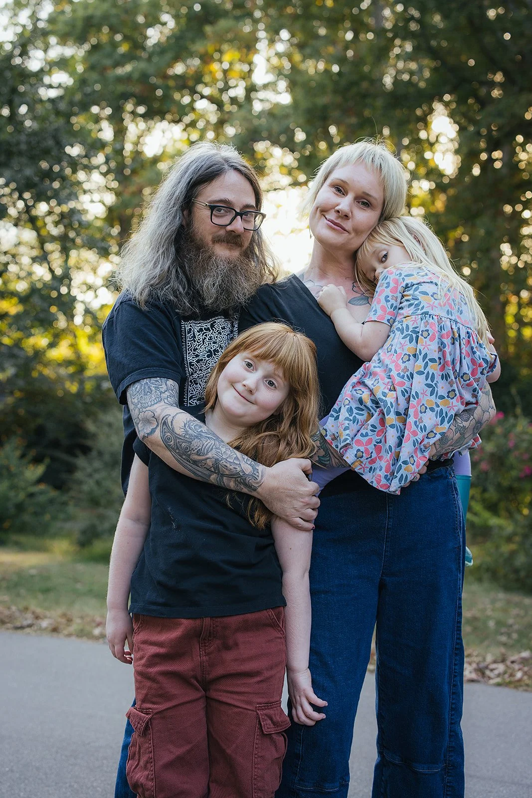 Family of Four Smiling Outside Family Photography