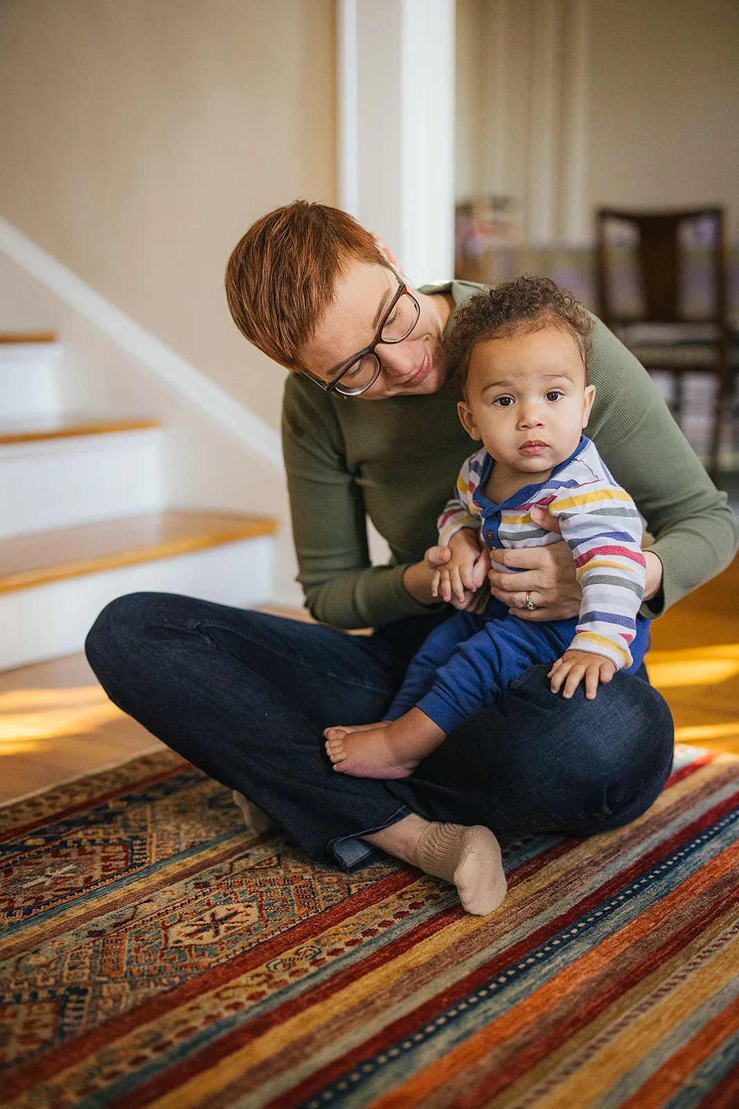 Mom Lovingly Looking at Baby During Family Photo Session