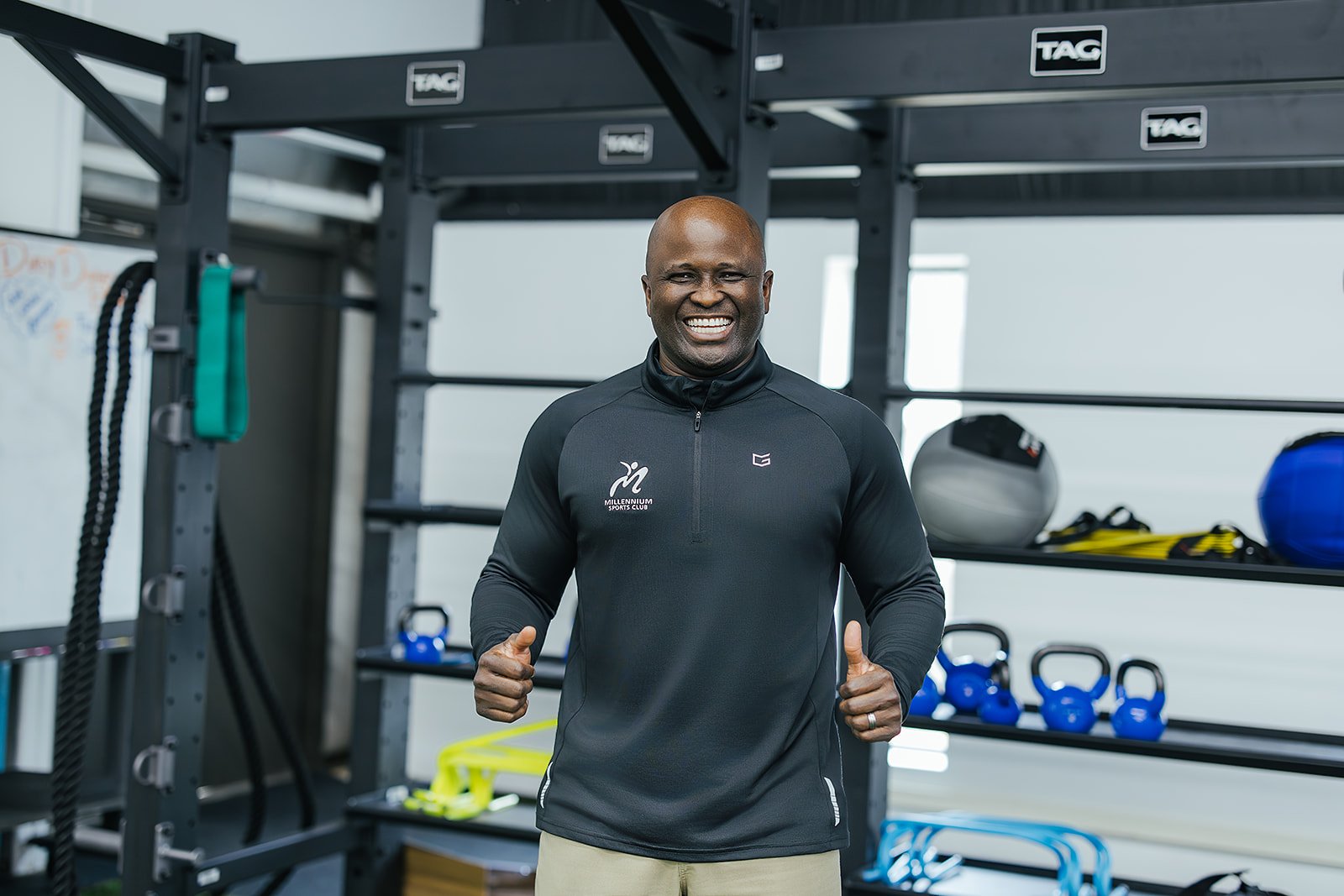 Personal trainer smiling during a sports club photoshoot