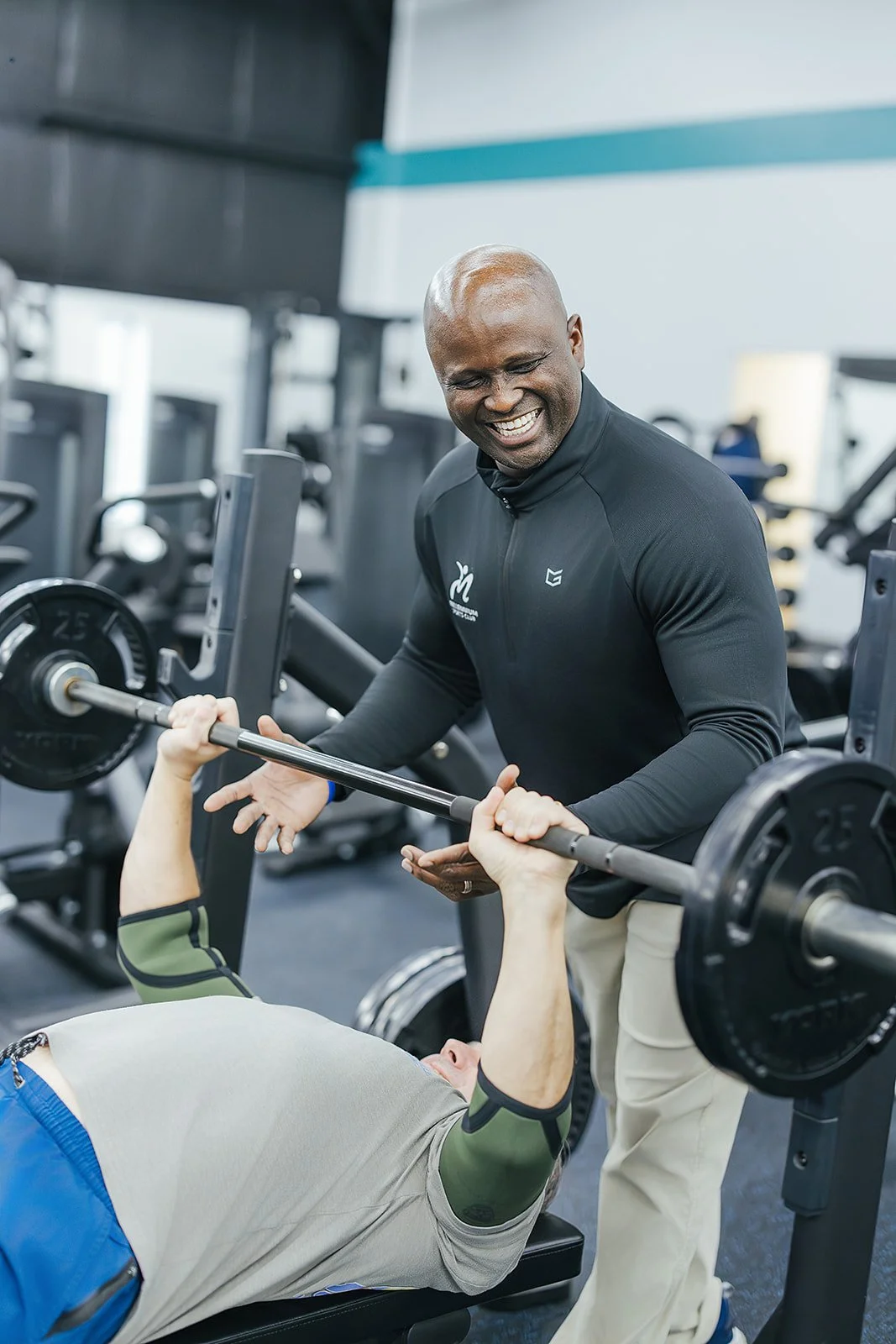Personal trainer poses at Durham, NC wellness center for local business photography