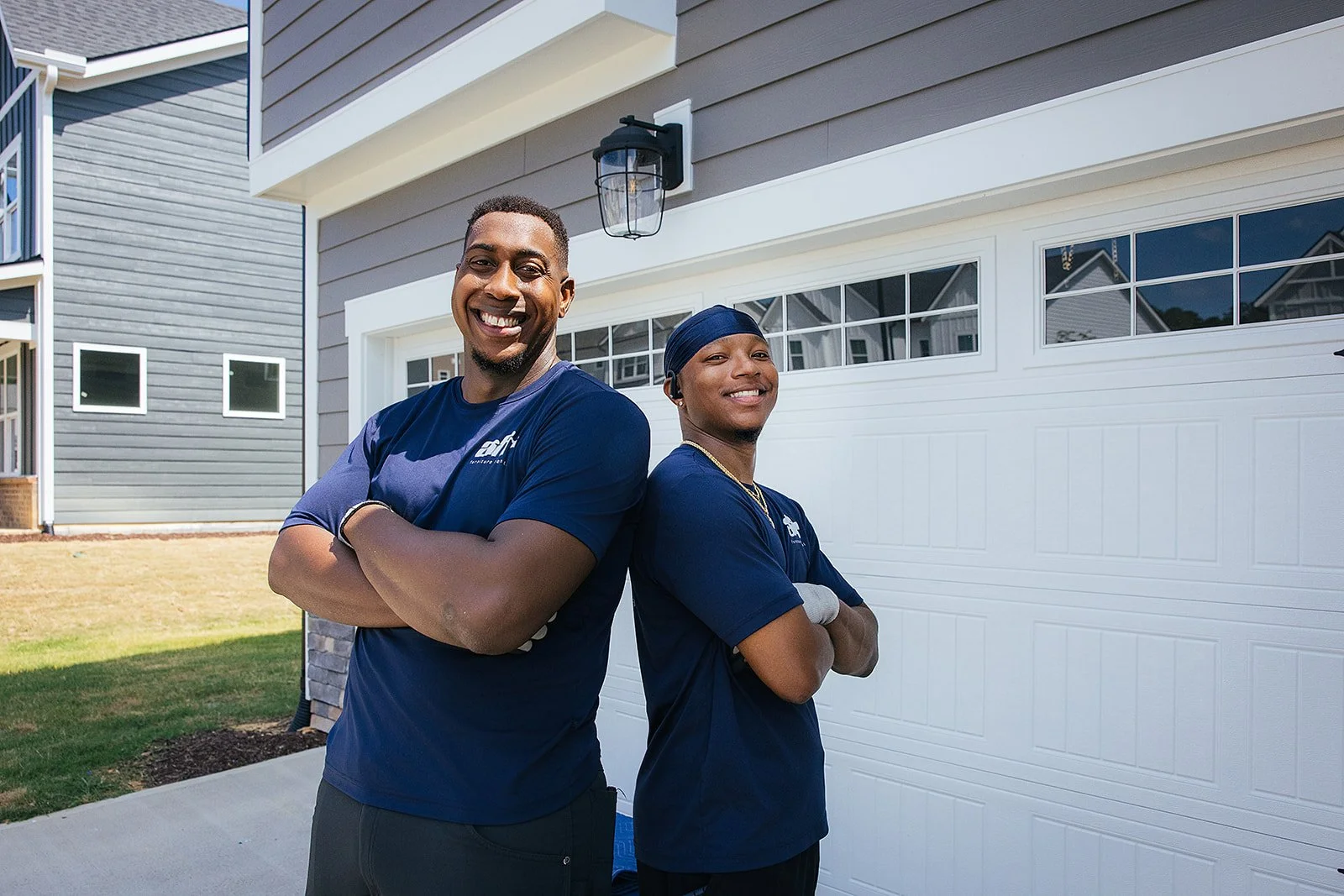 AFR Furniture Rental team moving furniture into a Durham home during a commercial photography session