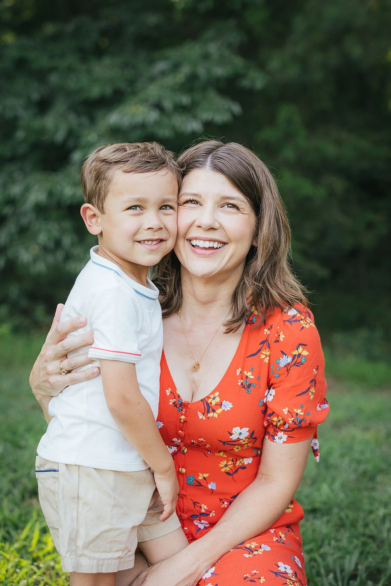 Mother and son in coordinating outfits smile for the camera during a Durham NC family photoshoot