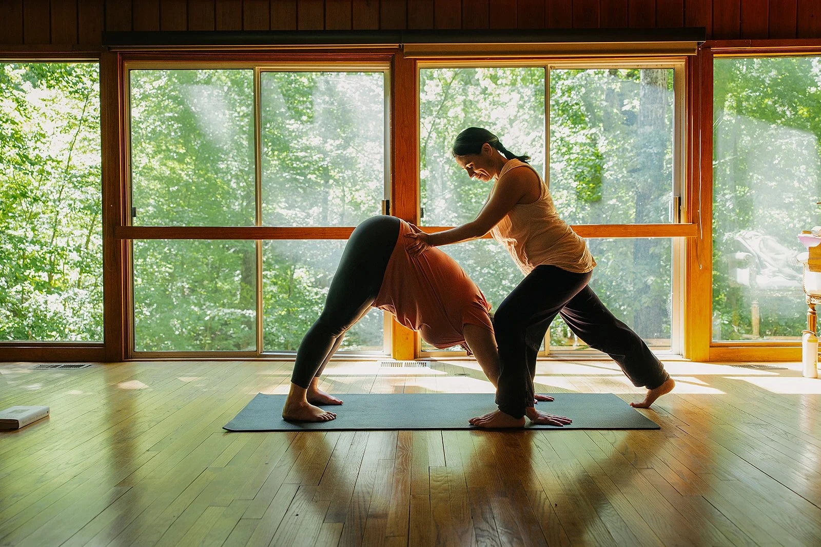 Yoga teacher in a grounded standing pose at The Trees, North Carolina