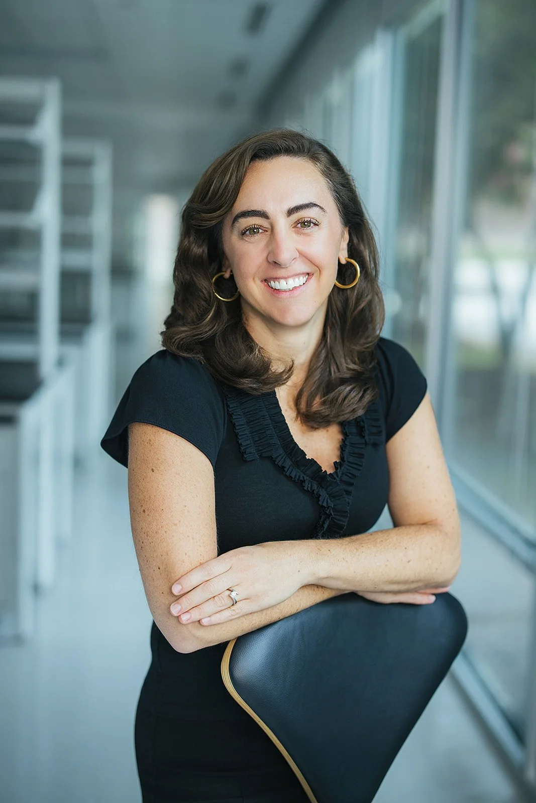 WomanCurlyBrownHairHeadshot
