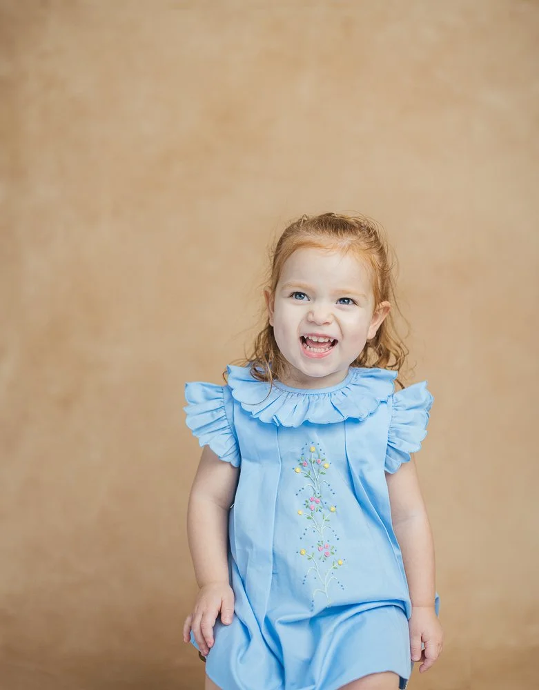 Girl smiles and laughs for a milestone portrait session in Durham, NC