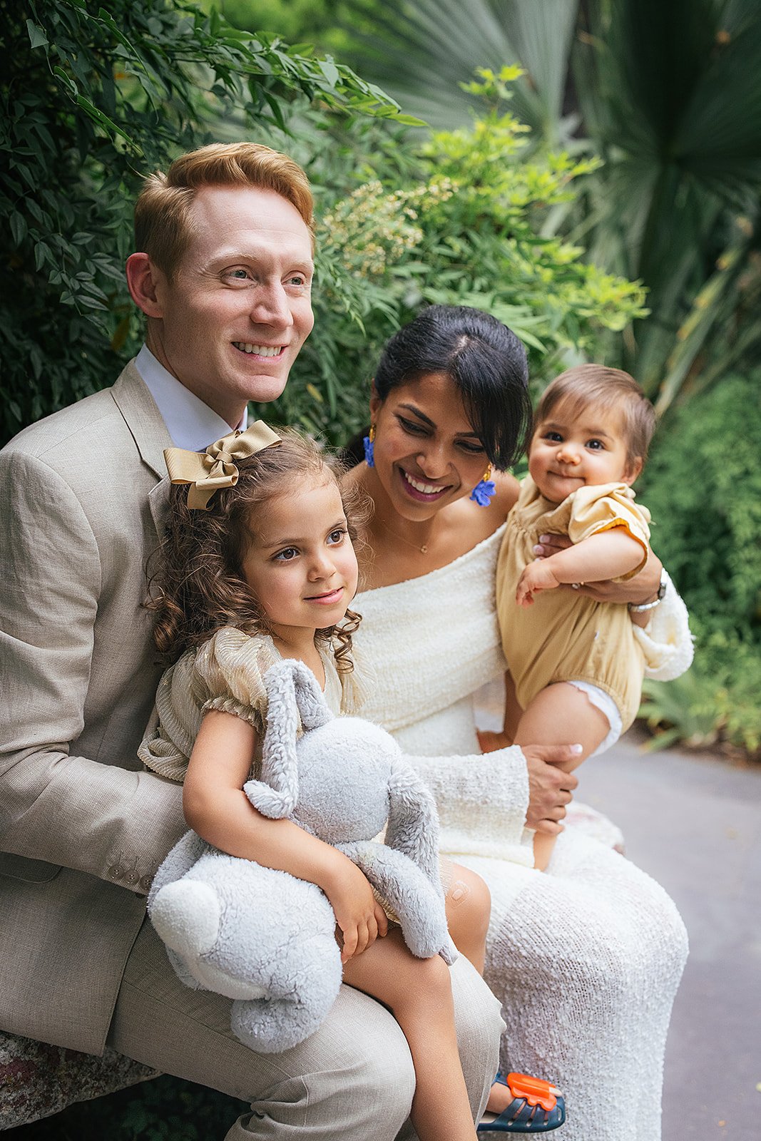 Family of Four Sitting and Smiling During Family Photography Session at Duke Gardens