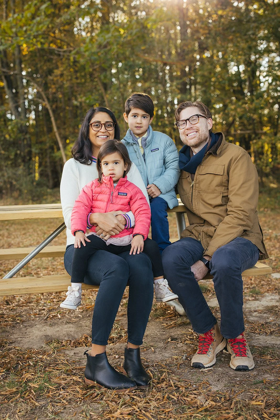 family of four sits in Blackwood Farm Park for Hillsborough family photoshoot