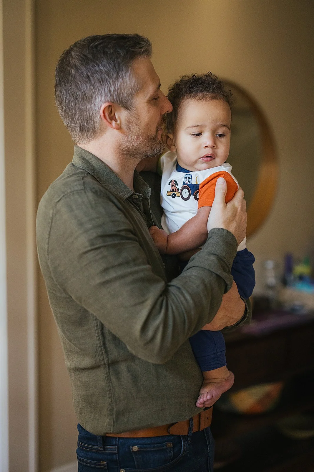 Dad Kissing Young Baby's Cheek Family Photo Session