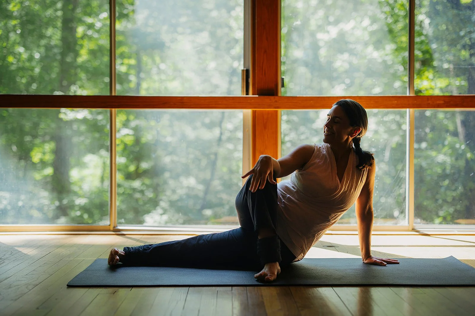 Grounded yoga pose photographed indoors in Durham, North Carolina