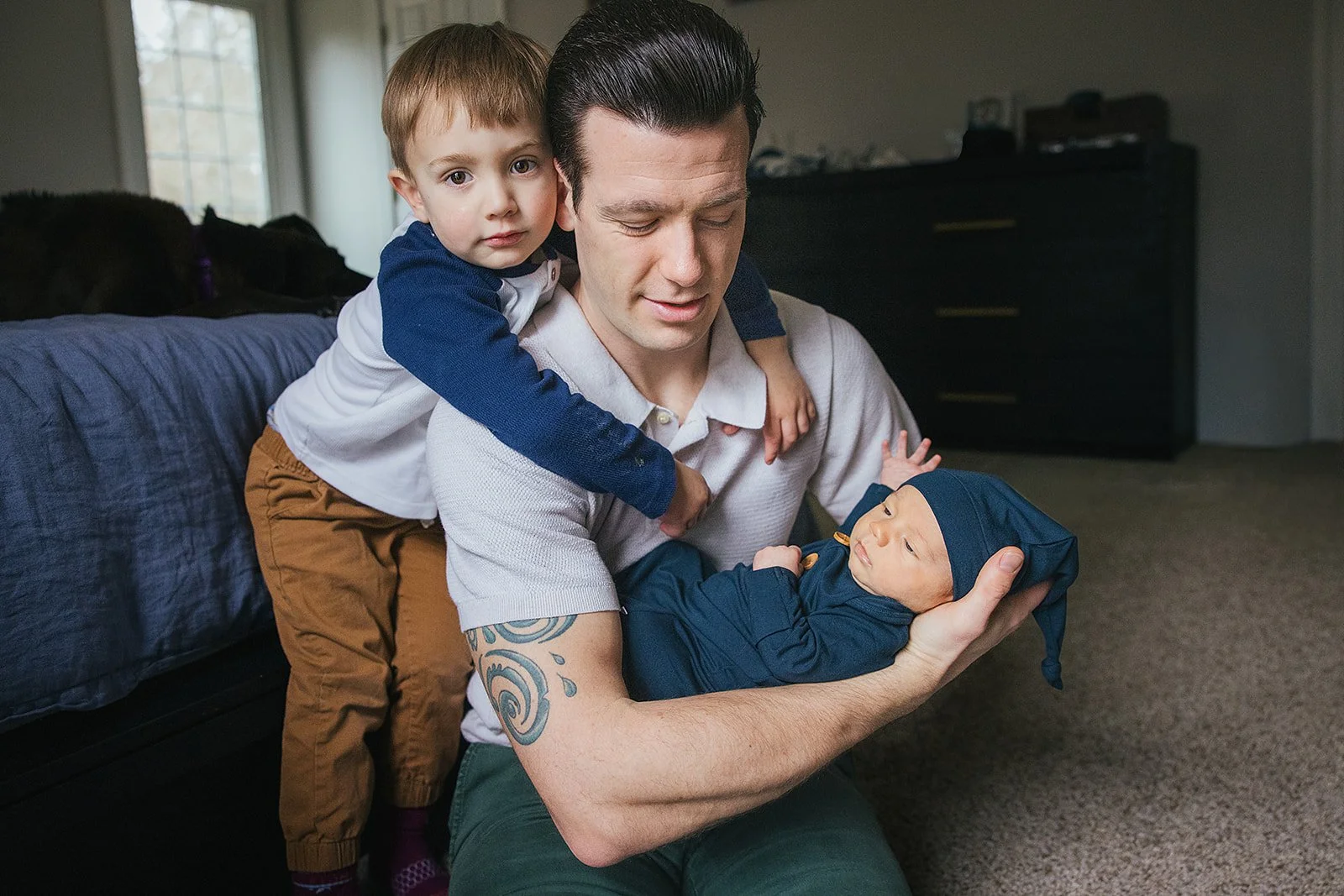 Father with two children pose for in-home family portraits in Durham, NC