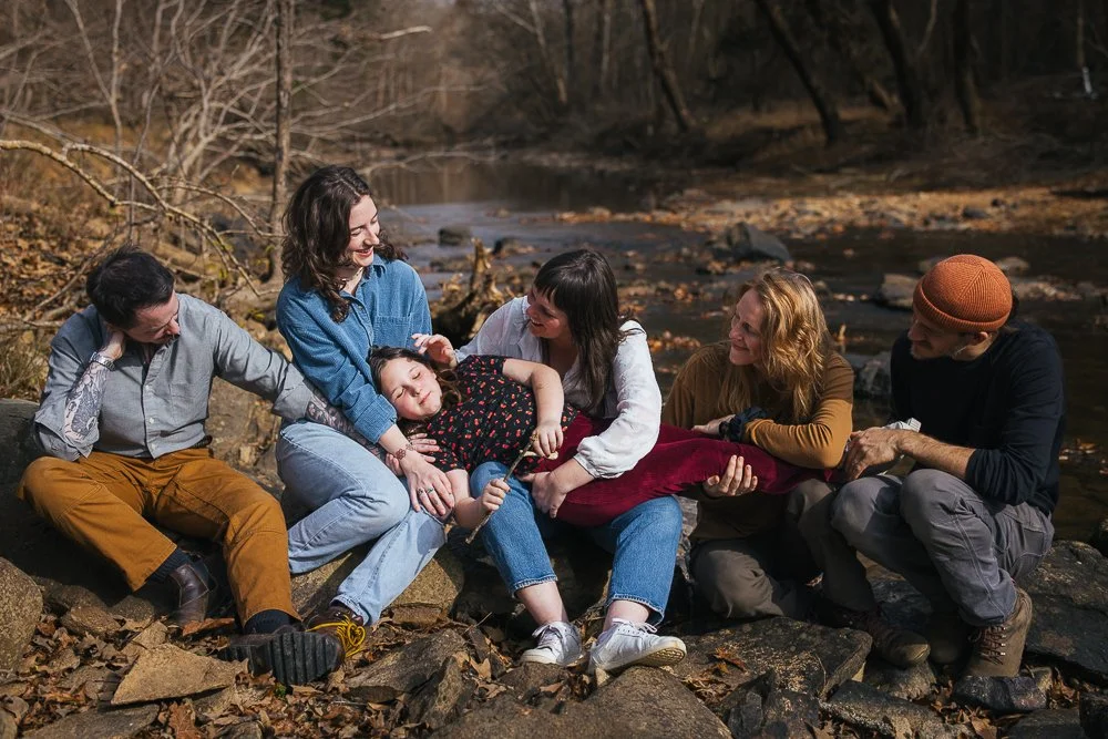 Friends and Family Sitting Together by Creek Durham NC