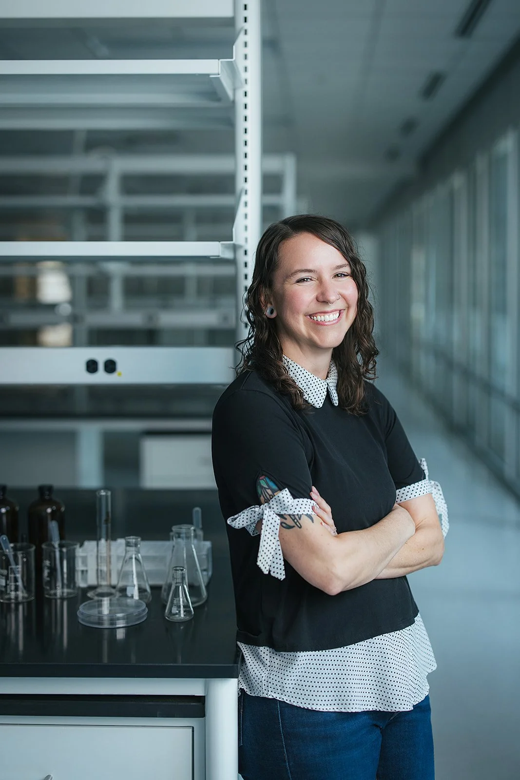 WomanArmsCrossedSmilingInLab