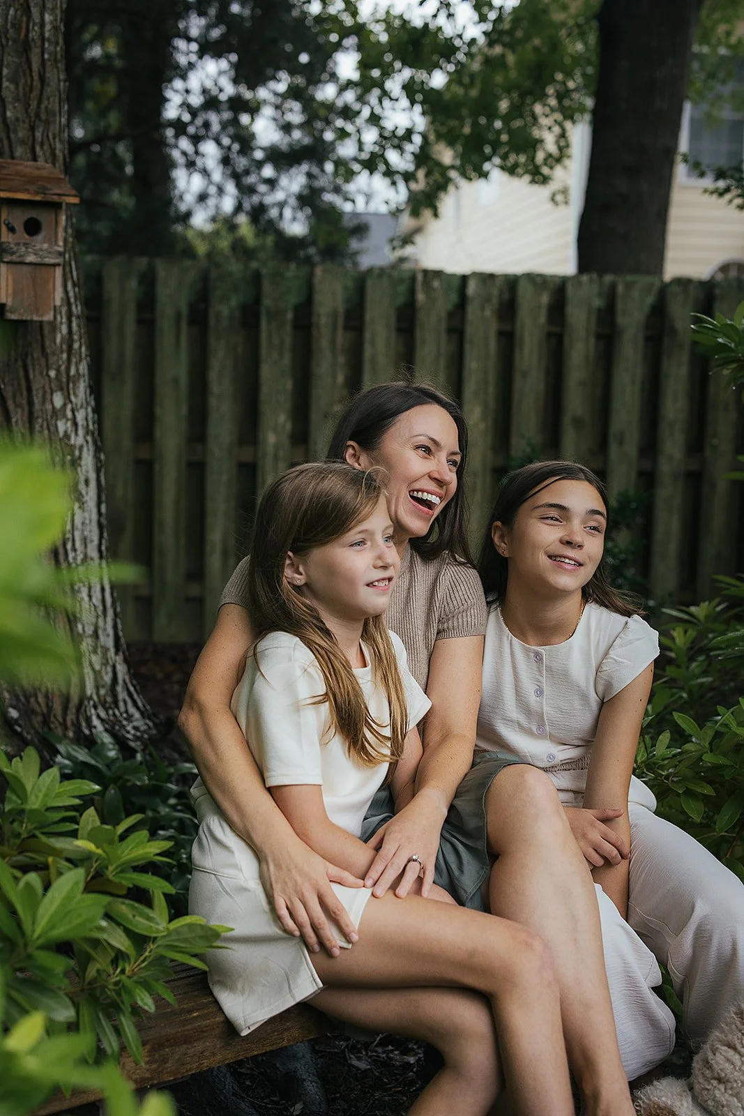 Mom laughing with daughters in backyard Chapel Hill NC