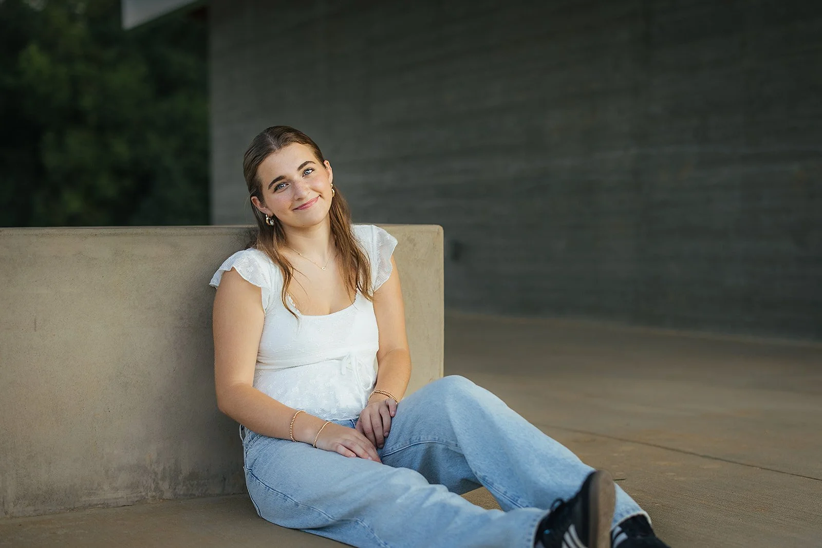 Senior Sitting and Smiling During Portrait Session