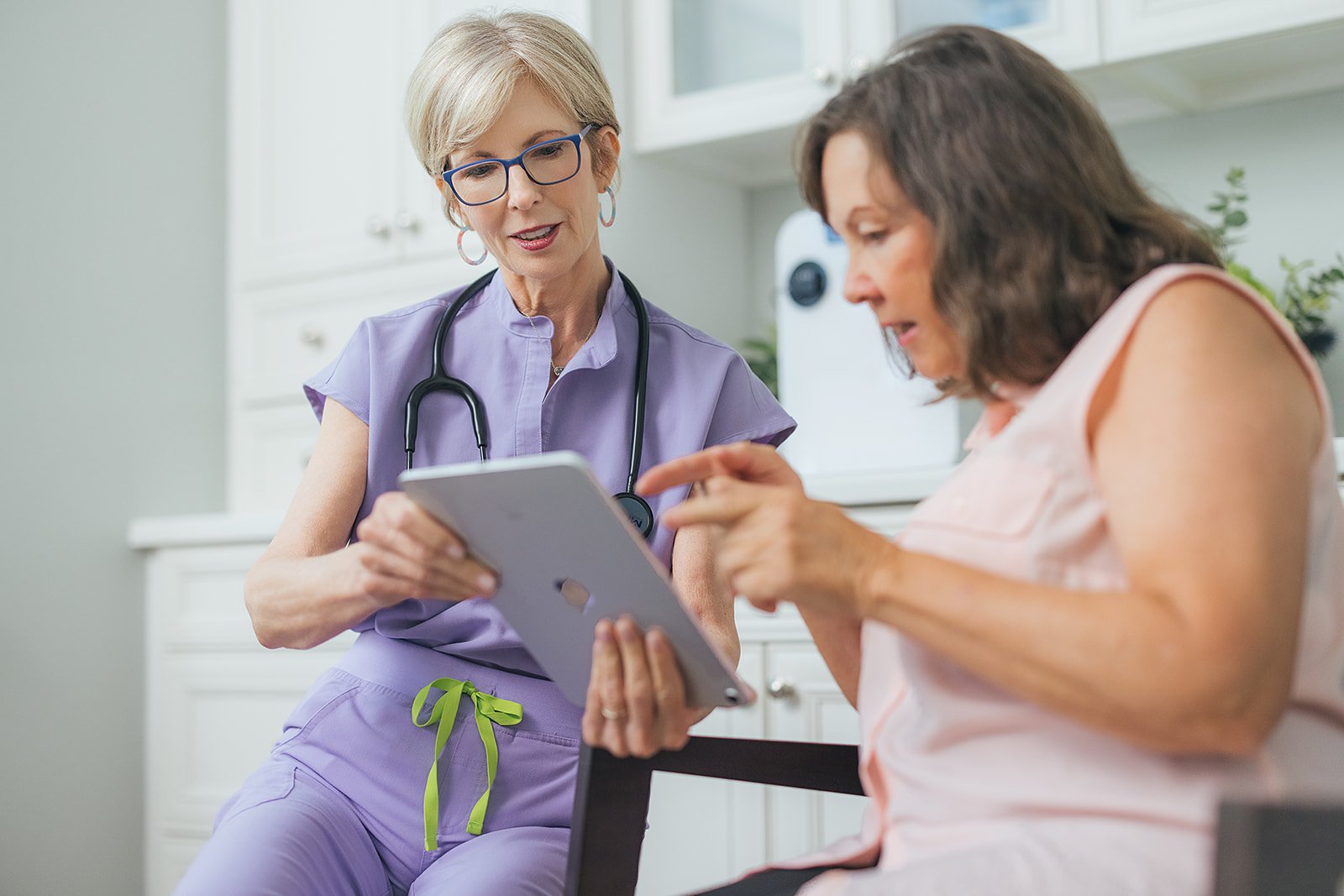 Medical Professional Showing Information to Patient In Branding Photography Session Durham NC