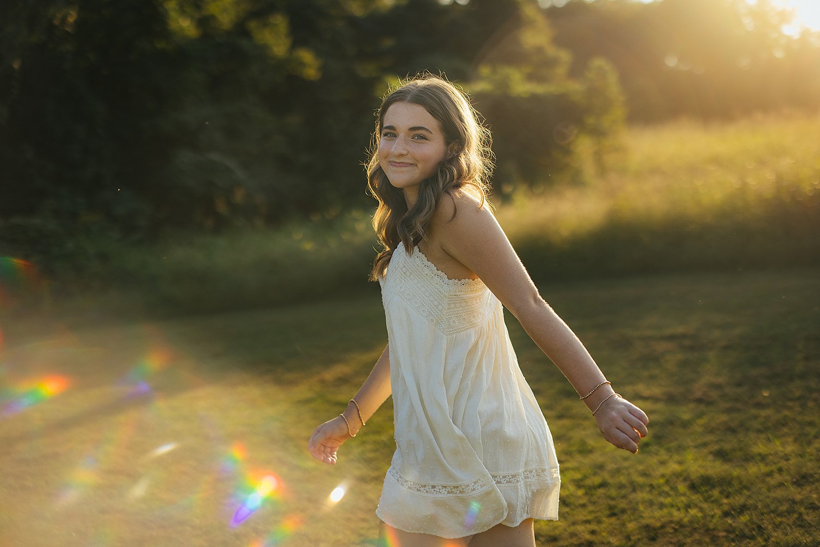 Senior Girl Running Through Fields at Golden Hour