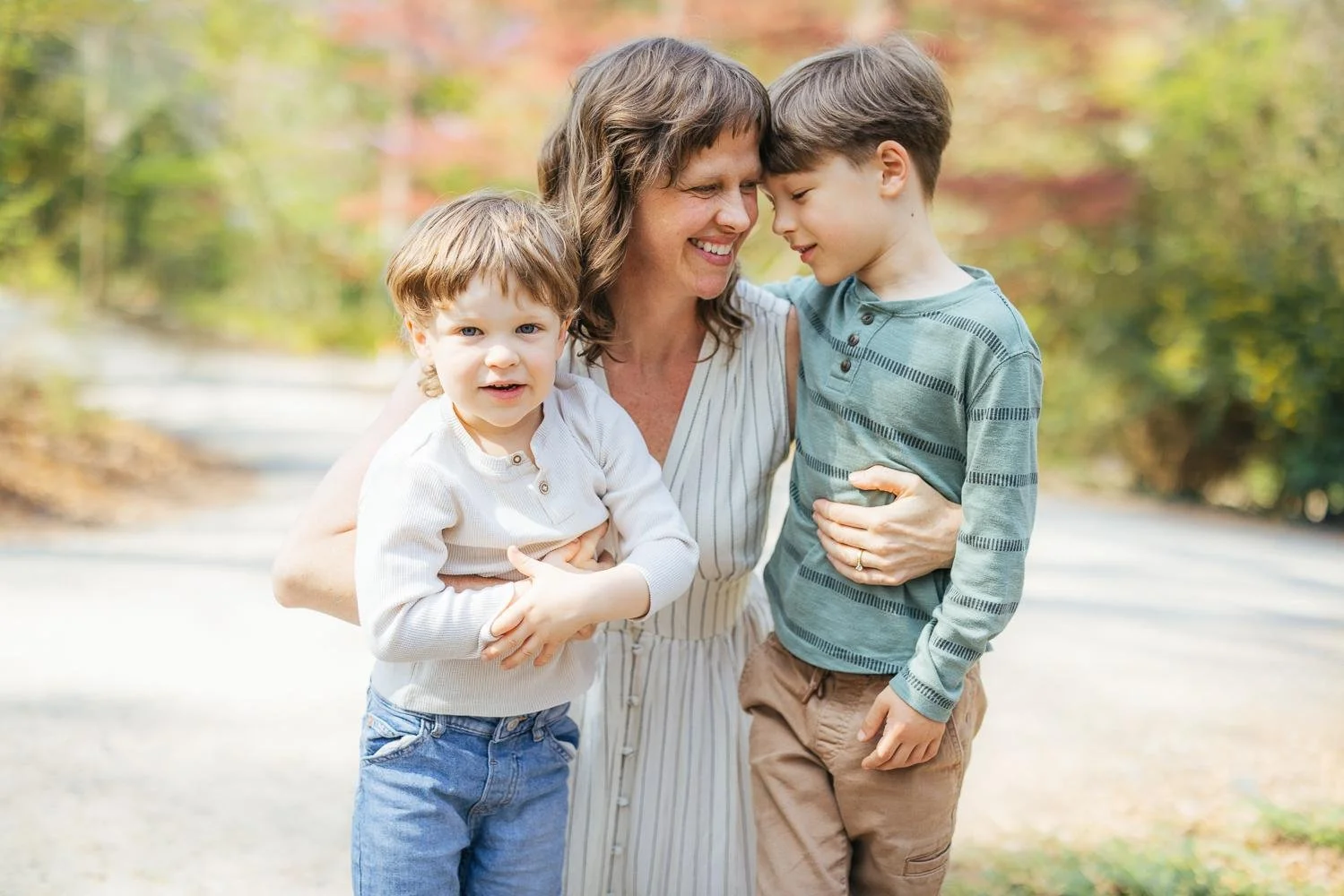 mother with her children for an interactive family lifestyle photoshoot in Durham, NC