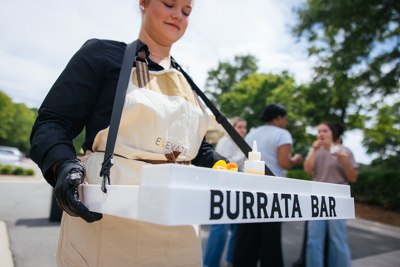 Woman Holding Burrata Bar Tray Serving Food Raleigh Event Photography
