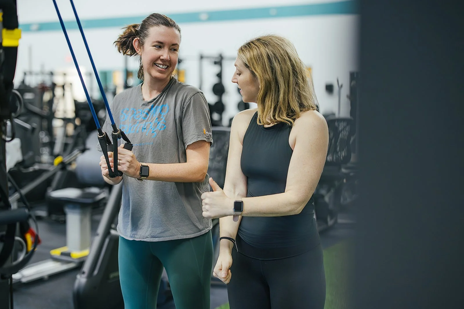 Two women at a gym during a sports club photoshoot