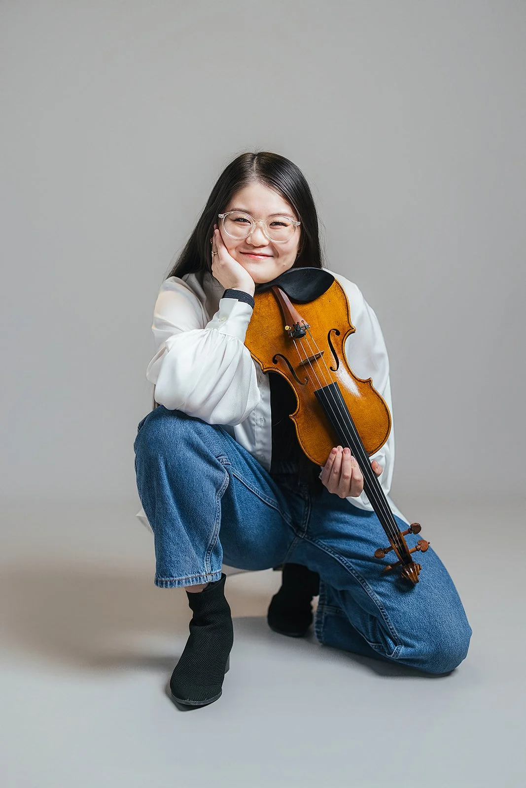 Woman Smiling Holding Violin During Branding Photography Session