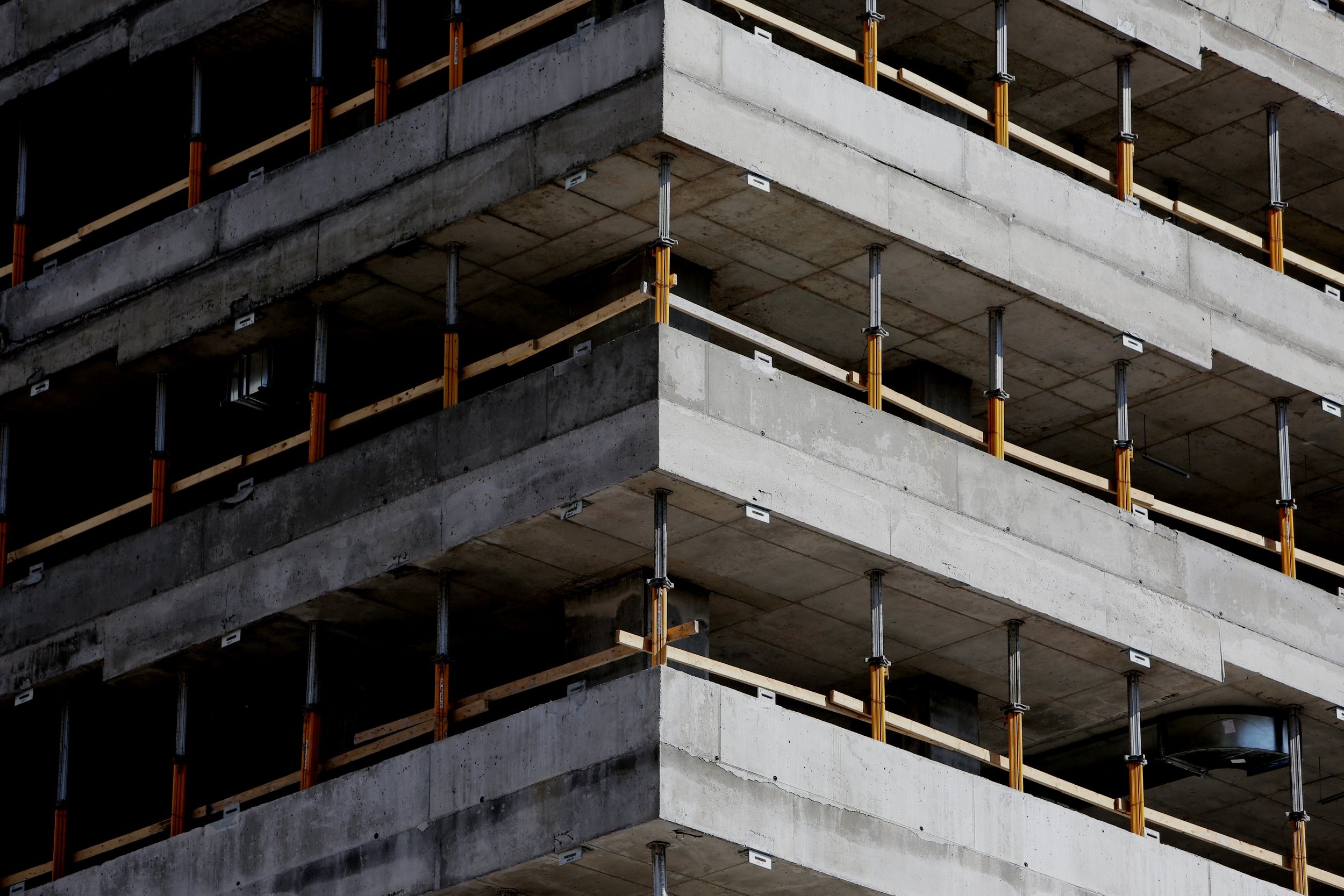 Canva+-+Gray+Concrete+Building+with+supports.jpg