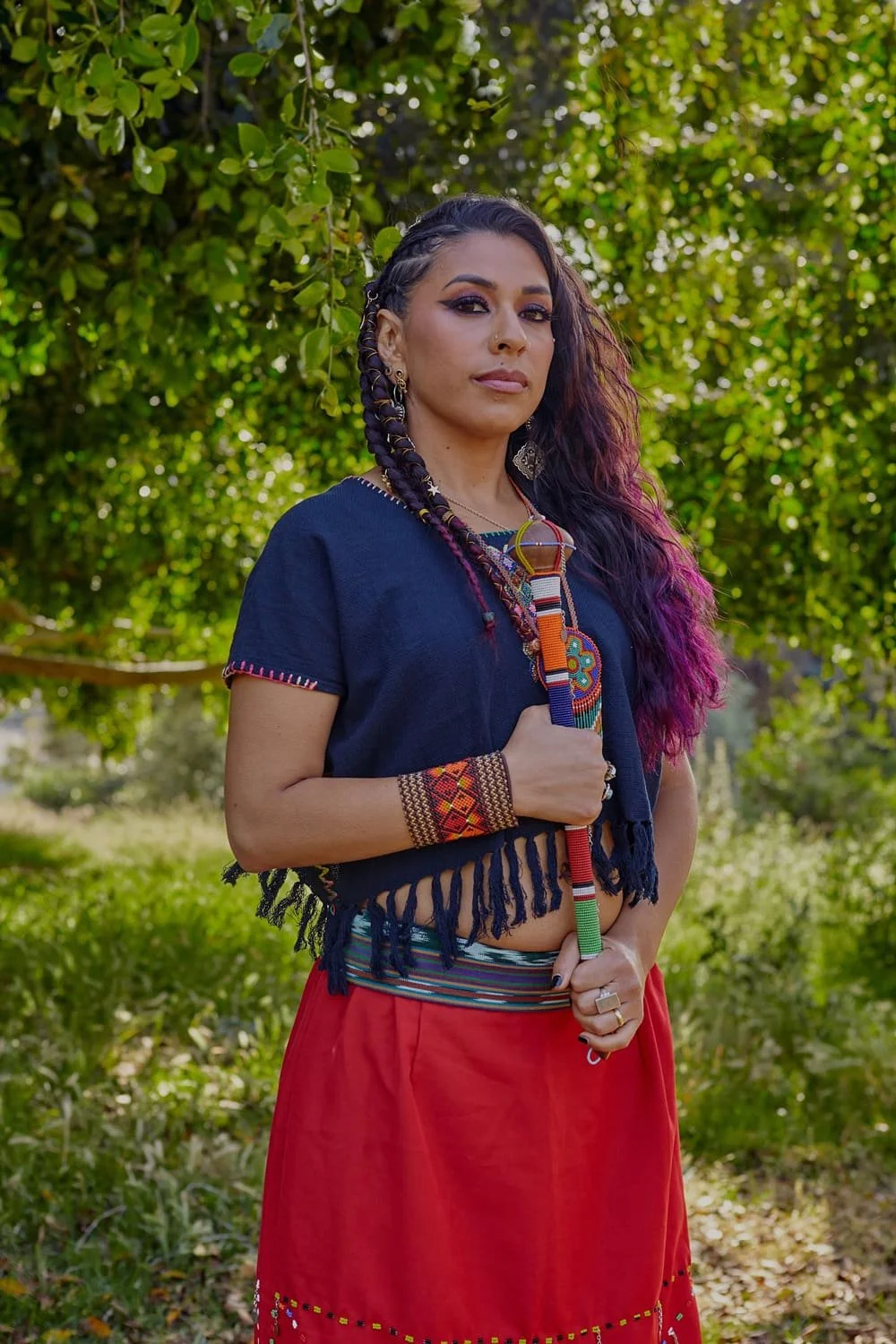 Personal Branding Photographer captures a Mexican Shaman with her trinket-filled altar under a tree. Personal Photo Shoot yields unique Studio Portraits, showcasing her personality in the style of celebrity Personal Branding Portraits.