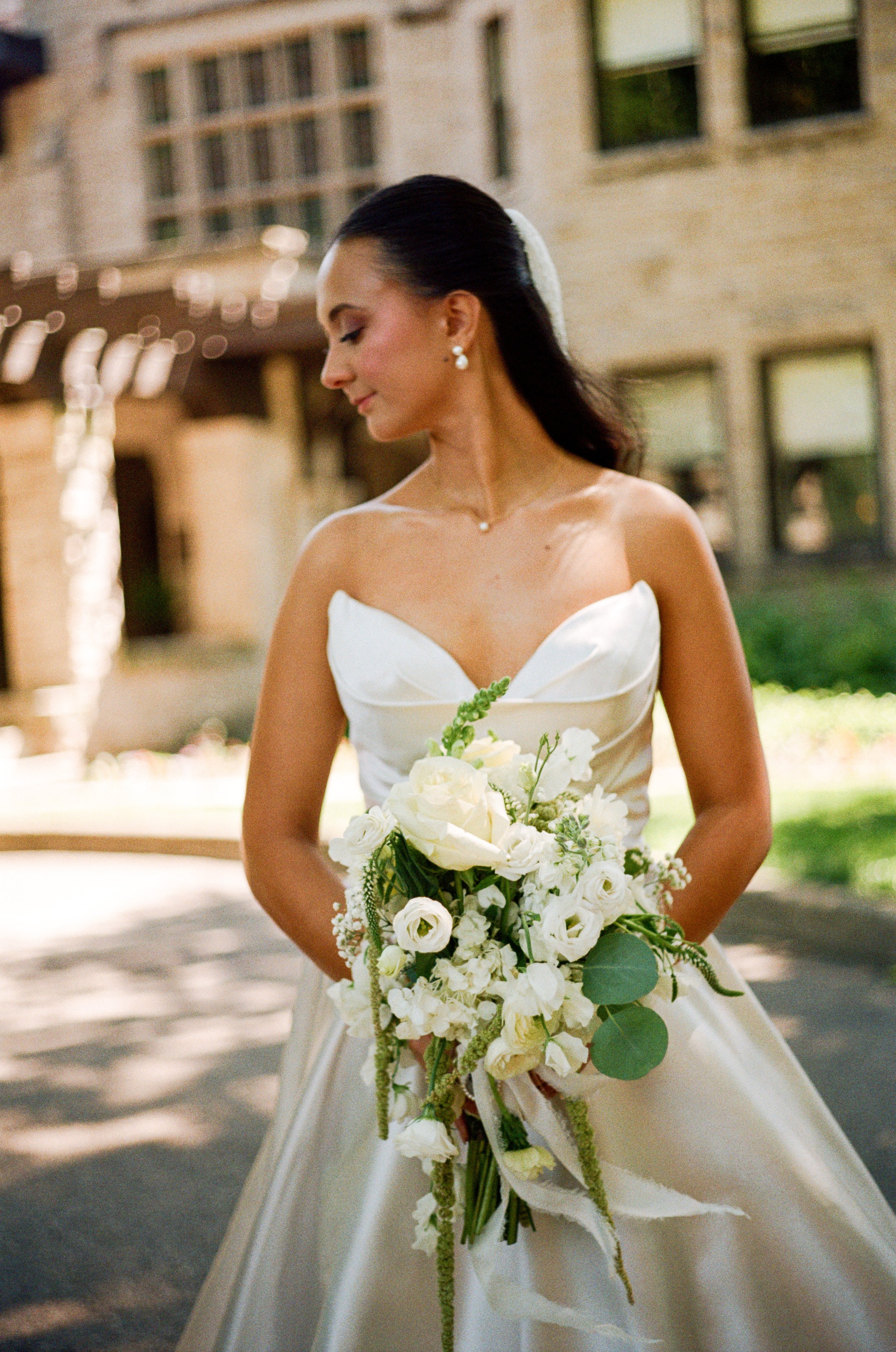 Film image of a bridal portrait with a documentary, editorial style at the Henry Ford Fair Lane Fairlane Estate in Dearborn, Michigan.