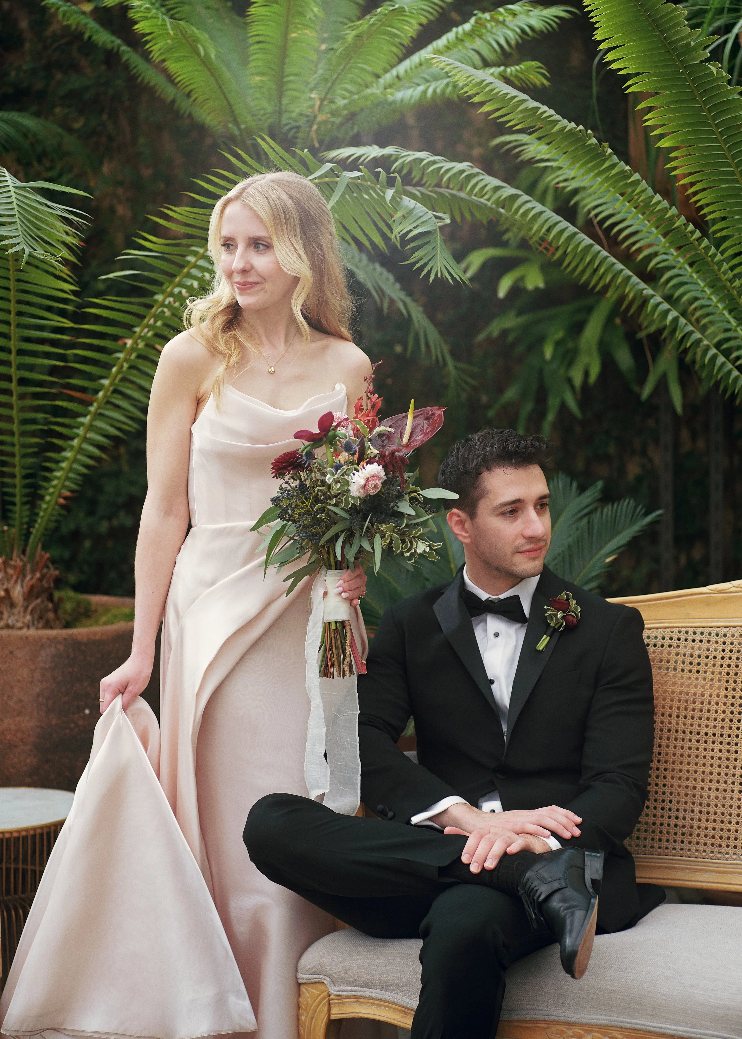 Bride and groom posed with greenery at Planterra wedding venue in West Bloomfield, Michigan. Wedding photography in Detroit, Michigan.