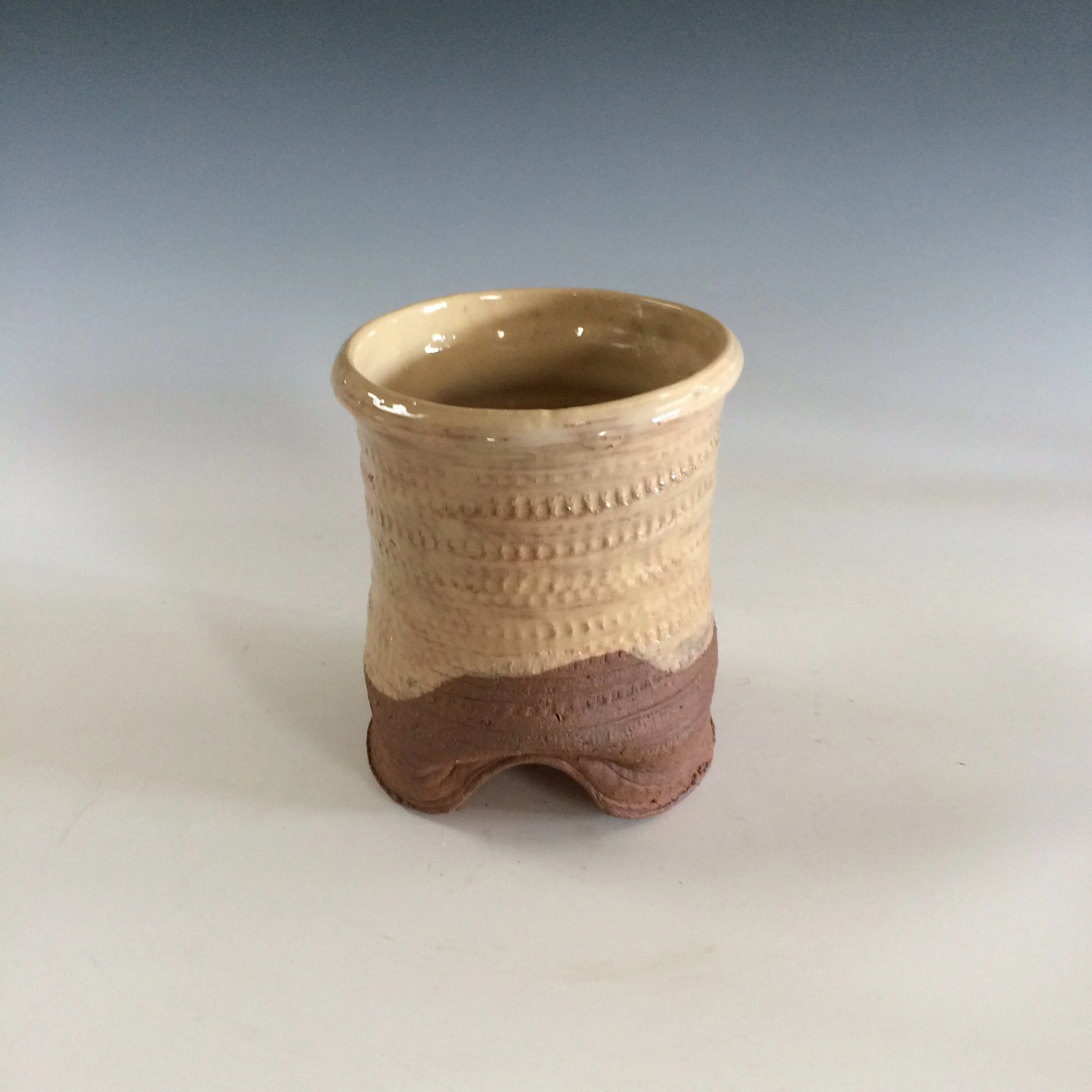 Cream utensil holder - dented base