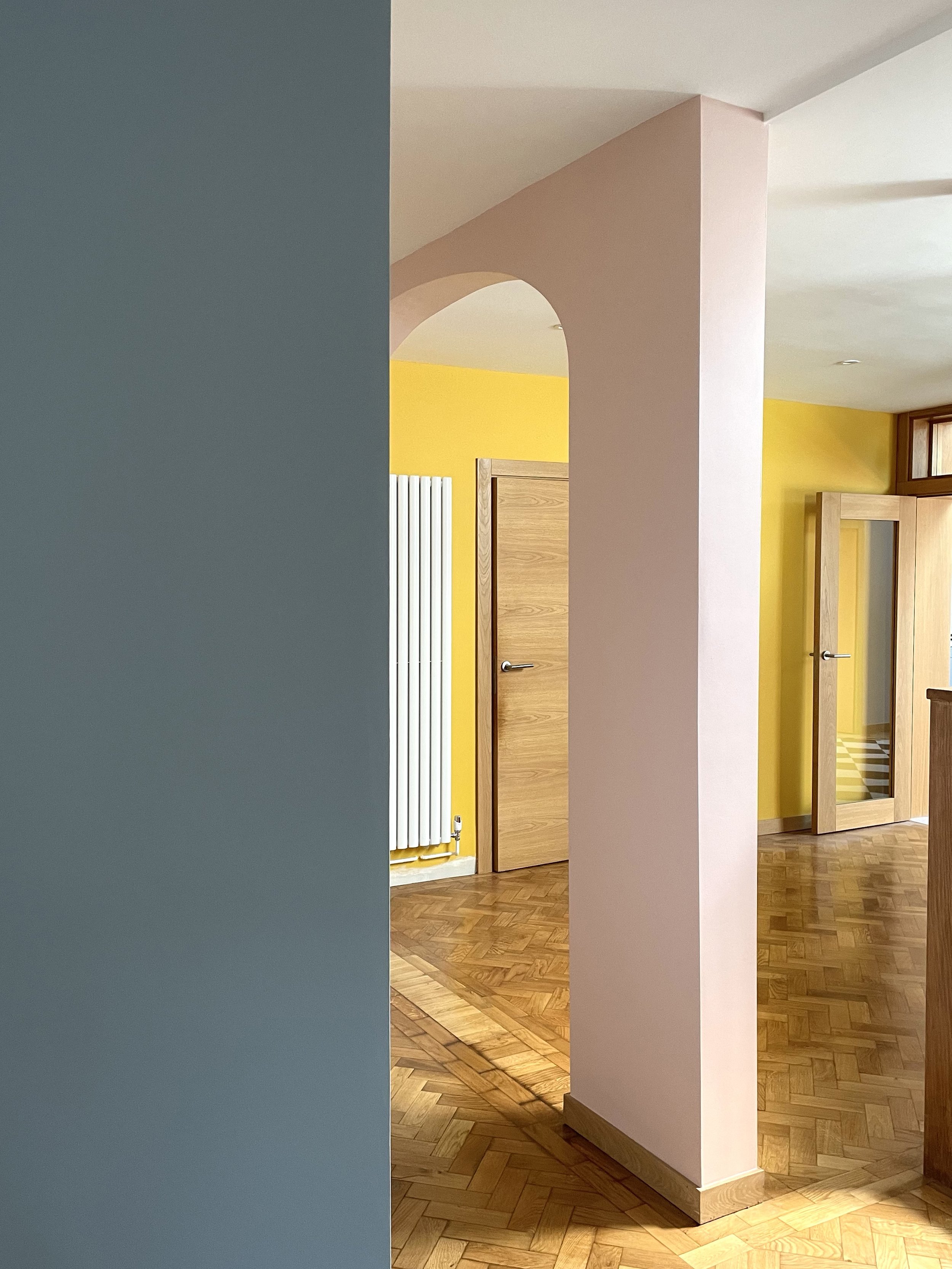 Charlotte Bucciero-Interiors-blue-yellow-wall-pink-arch-colourblocking-parquet-floor.jpg