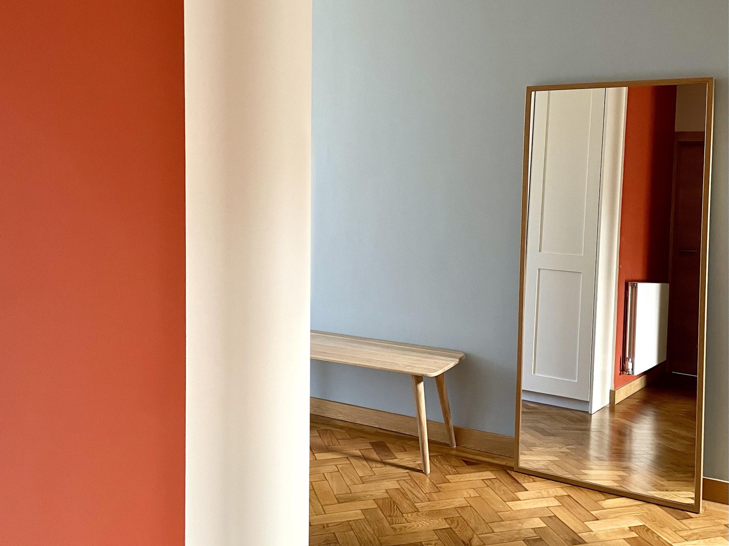 Charlotte Bucciero-Interiors-terracotta-wall-blue-colourblocking-parquet-bench-mirror.jpg