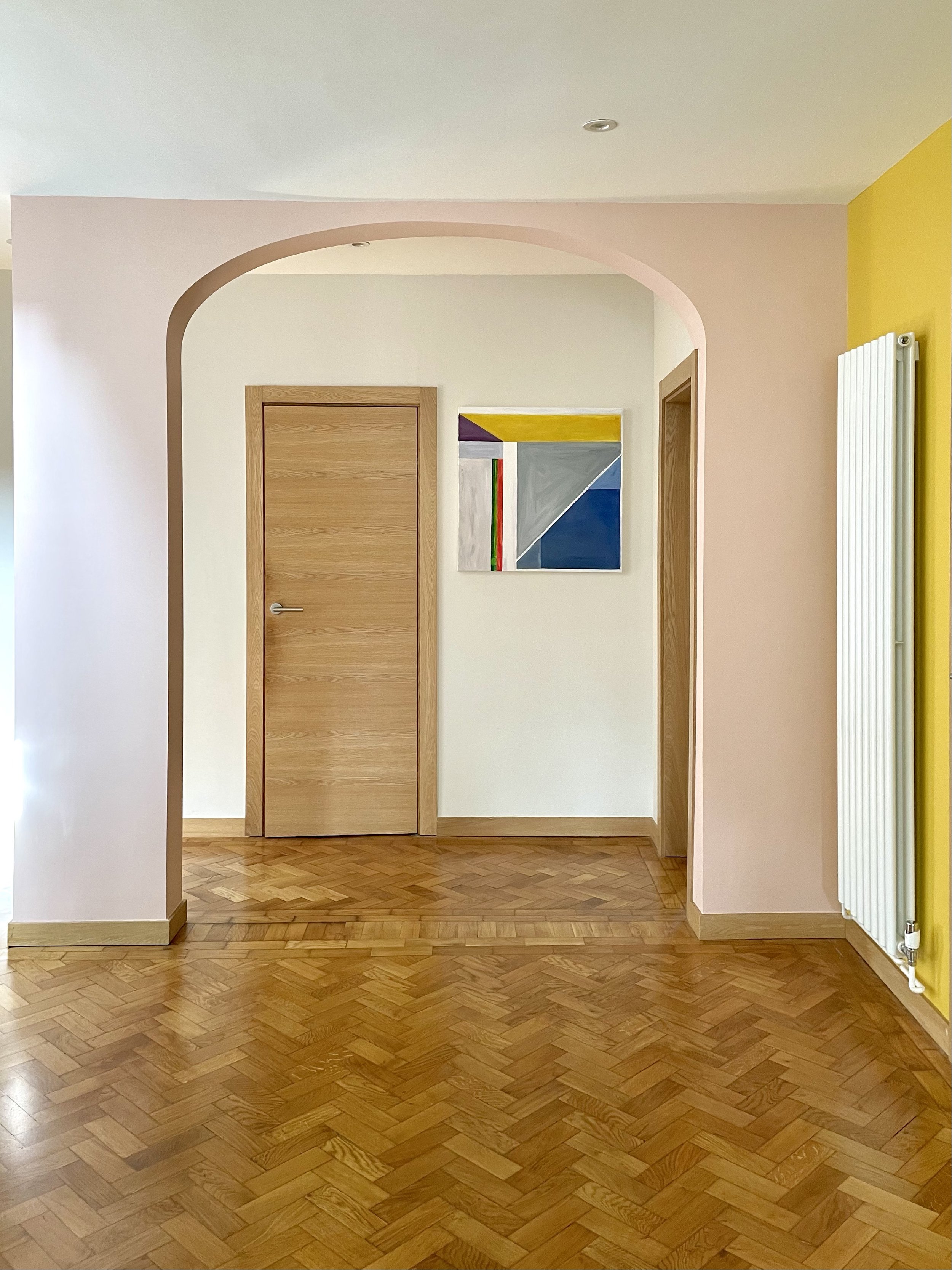 Charlotte Bucciero-Interiors-yellow-wall-pink-arch-colourblocking-parquet-floor.jpg