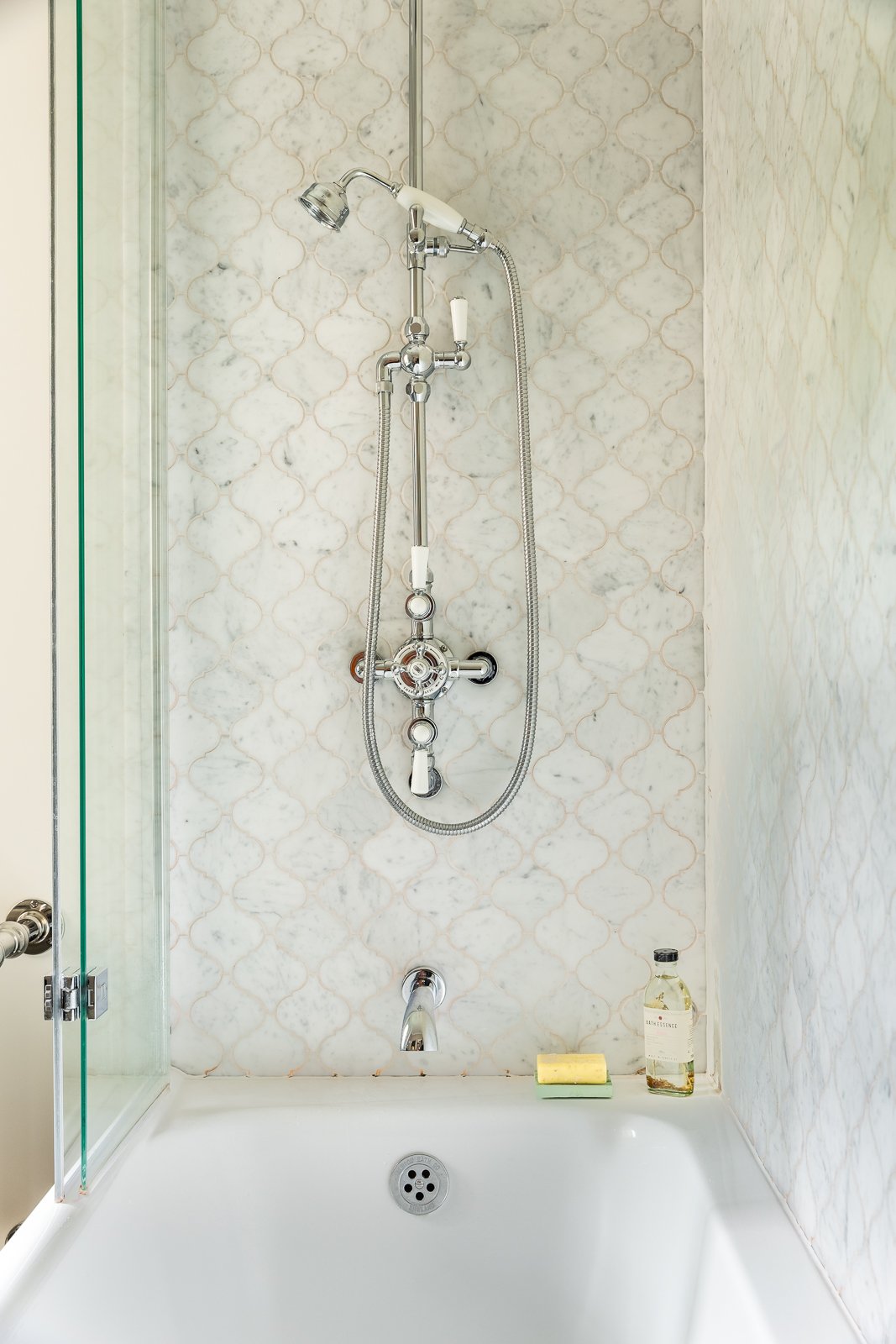CharlotteBucciero-interiors-shower-marble-tile-grey-bath-hand-shower.jpg