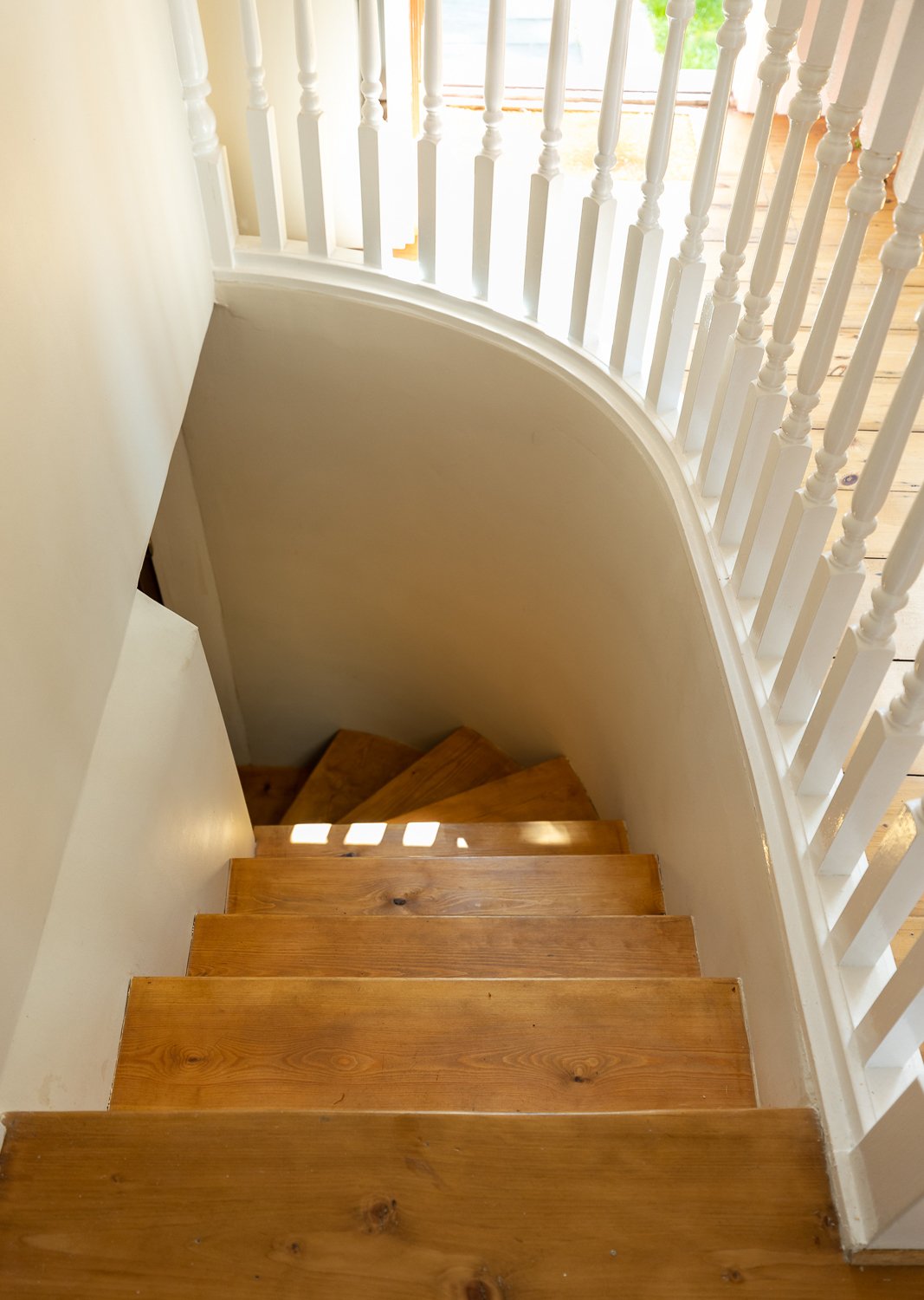 CharlotteBucciero-interiors-Spiral-staircase-oak-flooring-stairs-cream-basement.jpg