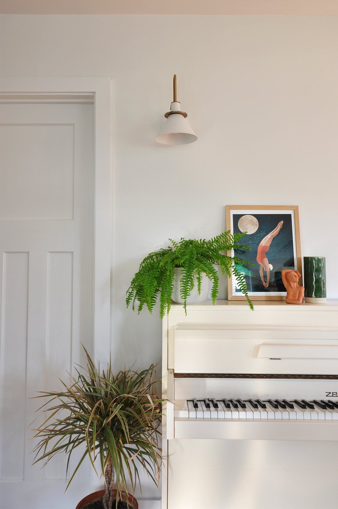 CharlotteBucciero-interiors-cream-piano-art-walllight-houseplant.jpg