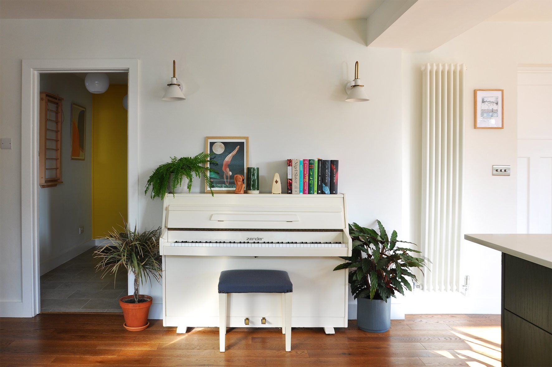 CharlotteBucciero-Interiors-white-piano-wall-light-oak-flooring-house-plant.jpg
