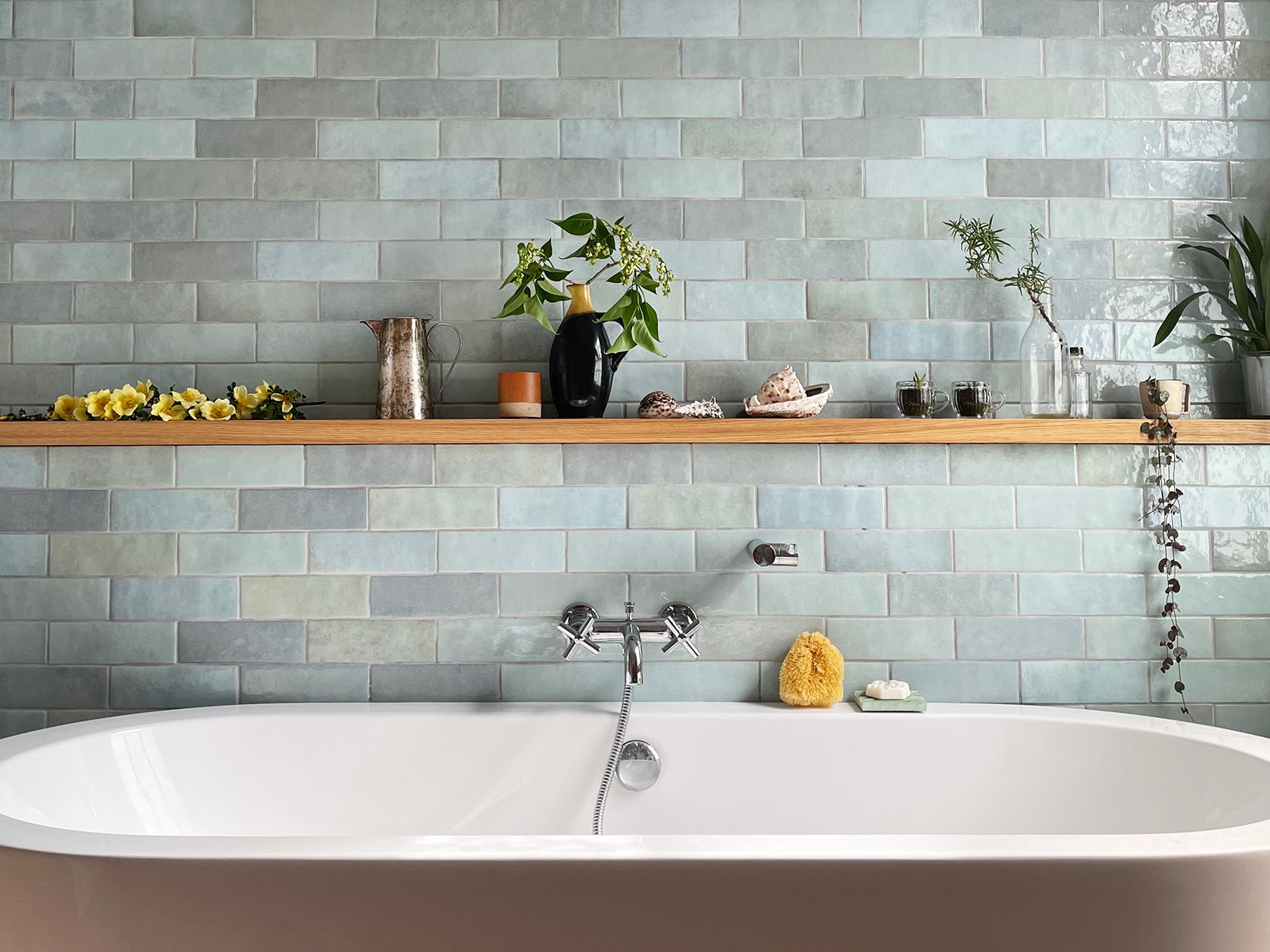 CharlotteBucciero-Interiors-Bathroom-oak-shelf-bathtub-blue-tiles-splashback.jpg